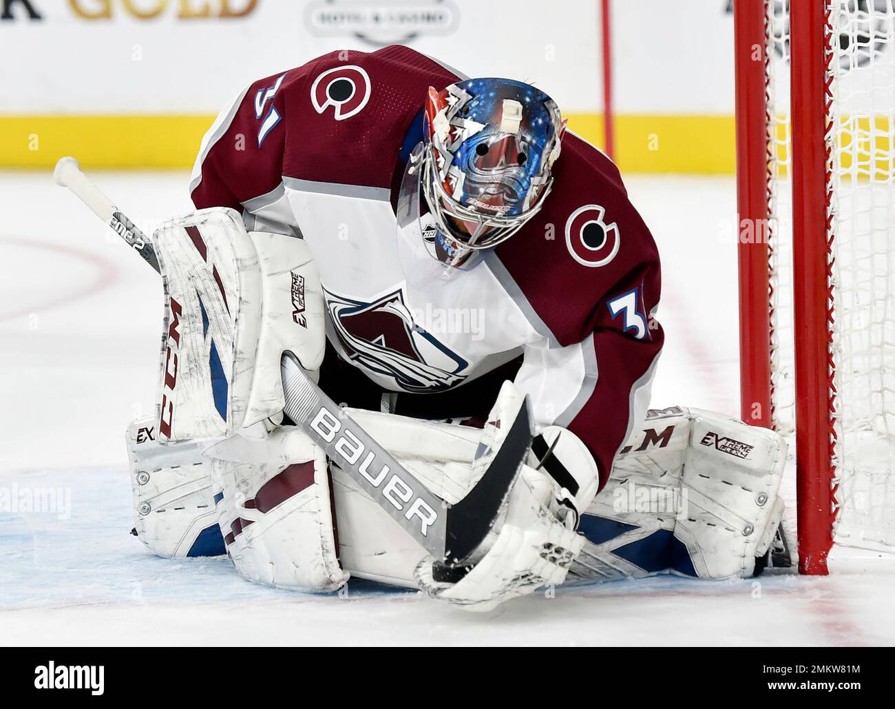 Colorado Avalanche goaltender Philipp Grubauer taps the puck with his