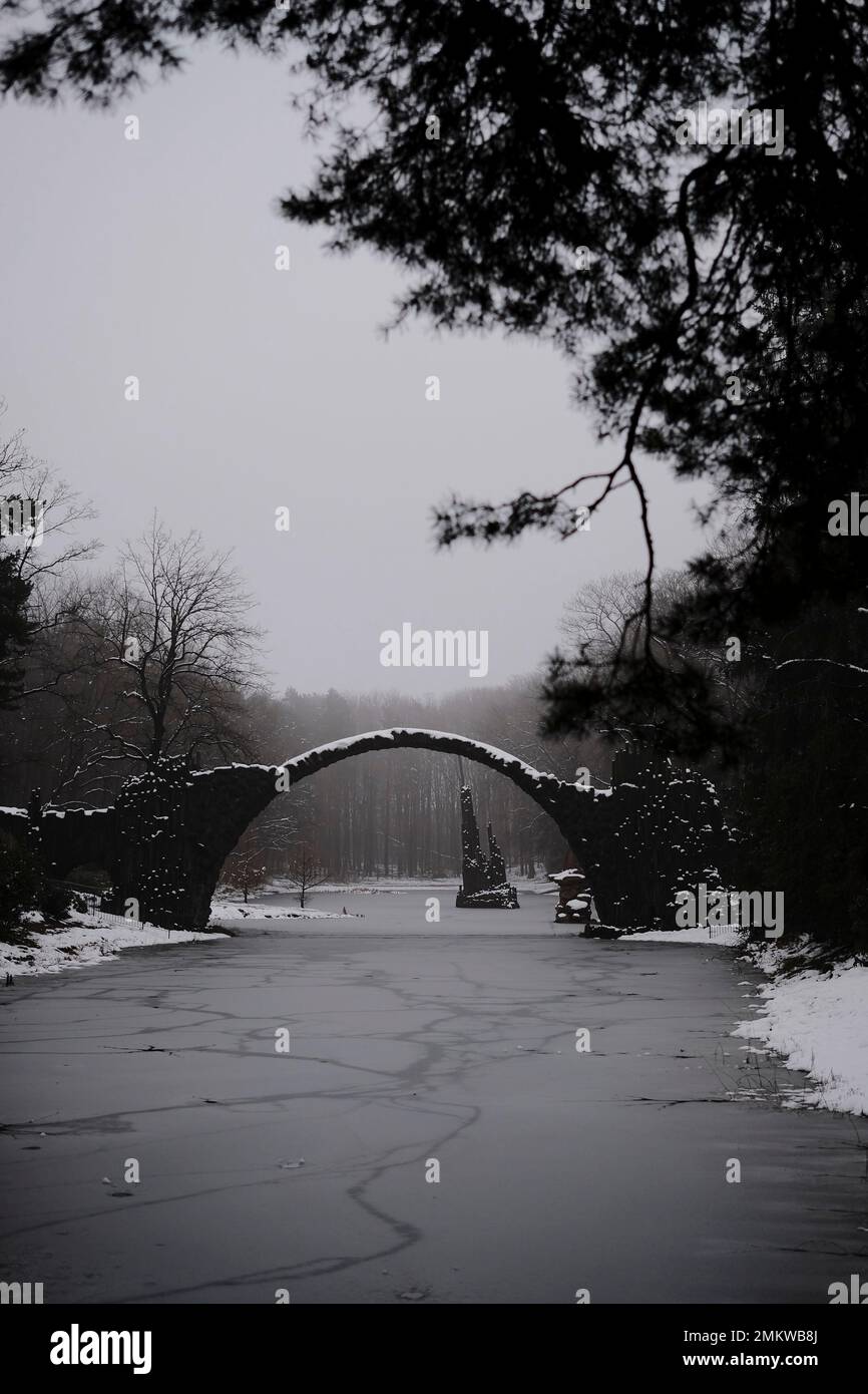 Middle Earth in Winter: An Old Stone Bridge over a Frozen Lake Stock ...