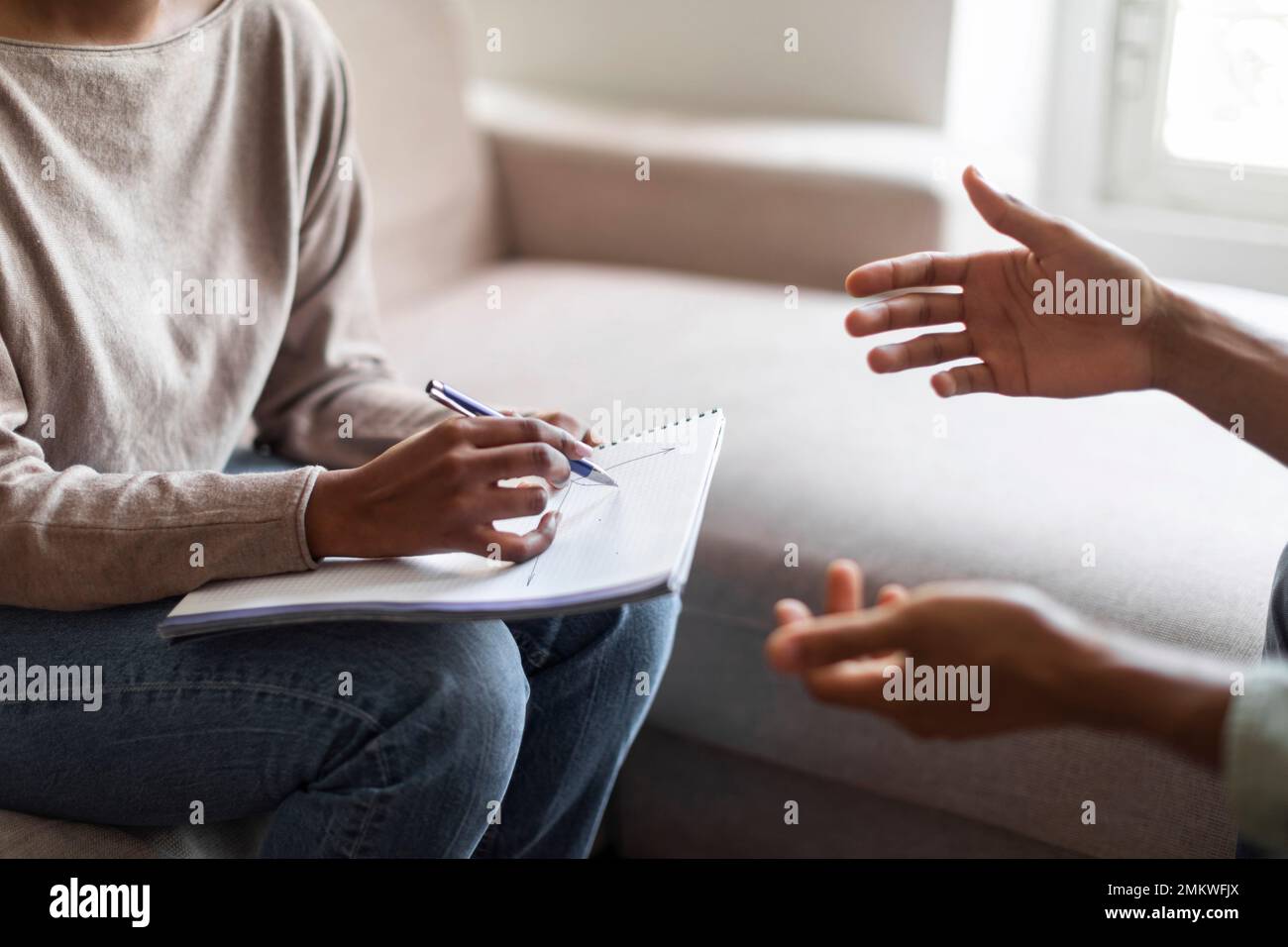 Therapist holding folder, pen and man patient hands, psychological help Stock Photo