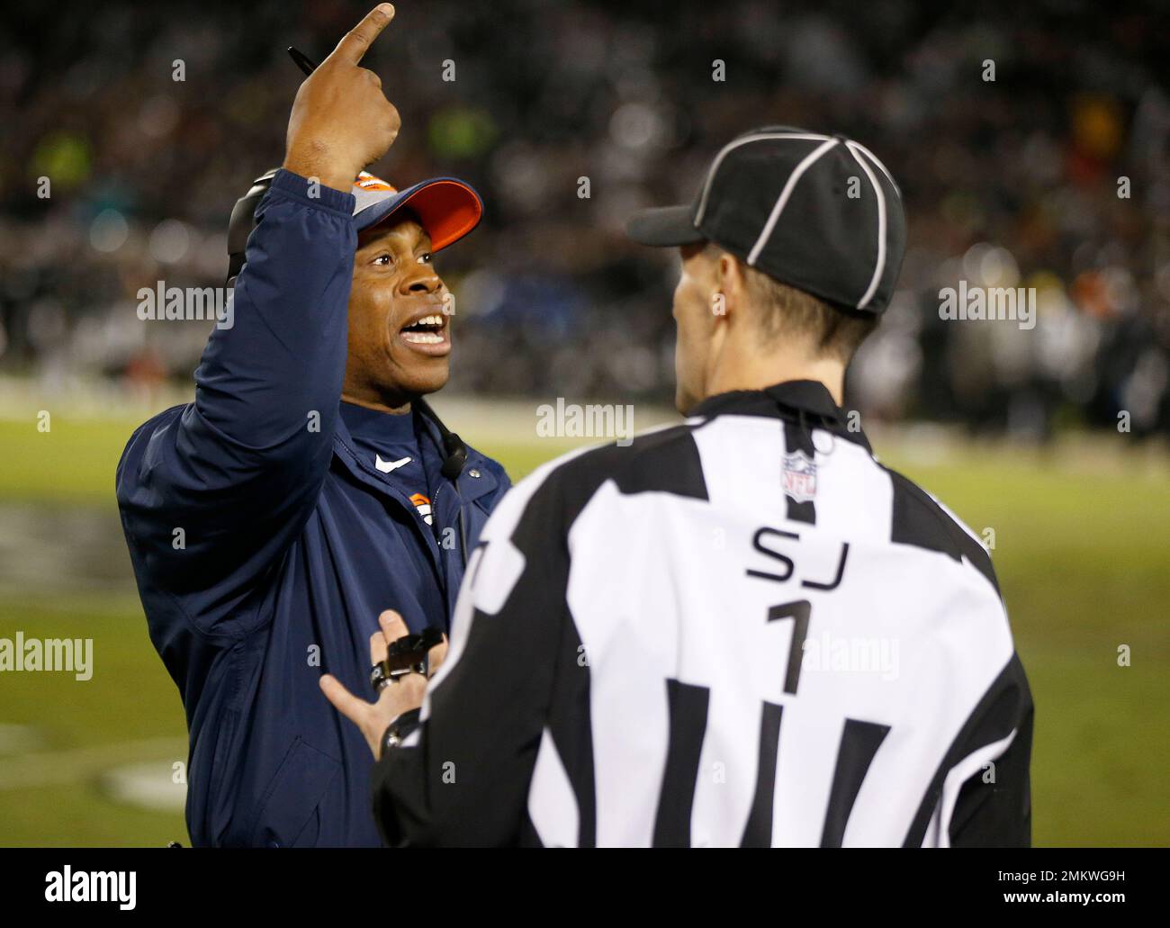 Denver Broncos head coach Vance Joseph, left, gestures while talking with side judge Scott Novak during the first half of an NFL football game between the Oakland Raiders and the Broncos in Denver Broncos head coach Vance Joseph, left, gestures while talking with side judge Scott Novak during the first half of an NFL football game between the Oakland Raiders and the Broncos in