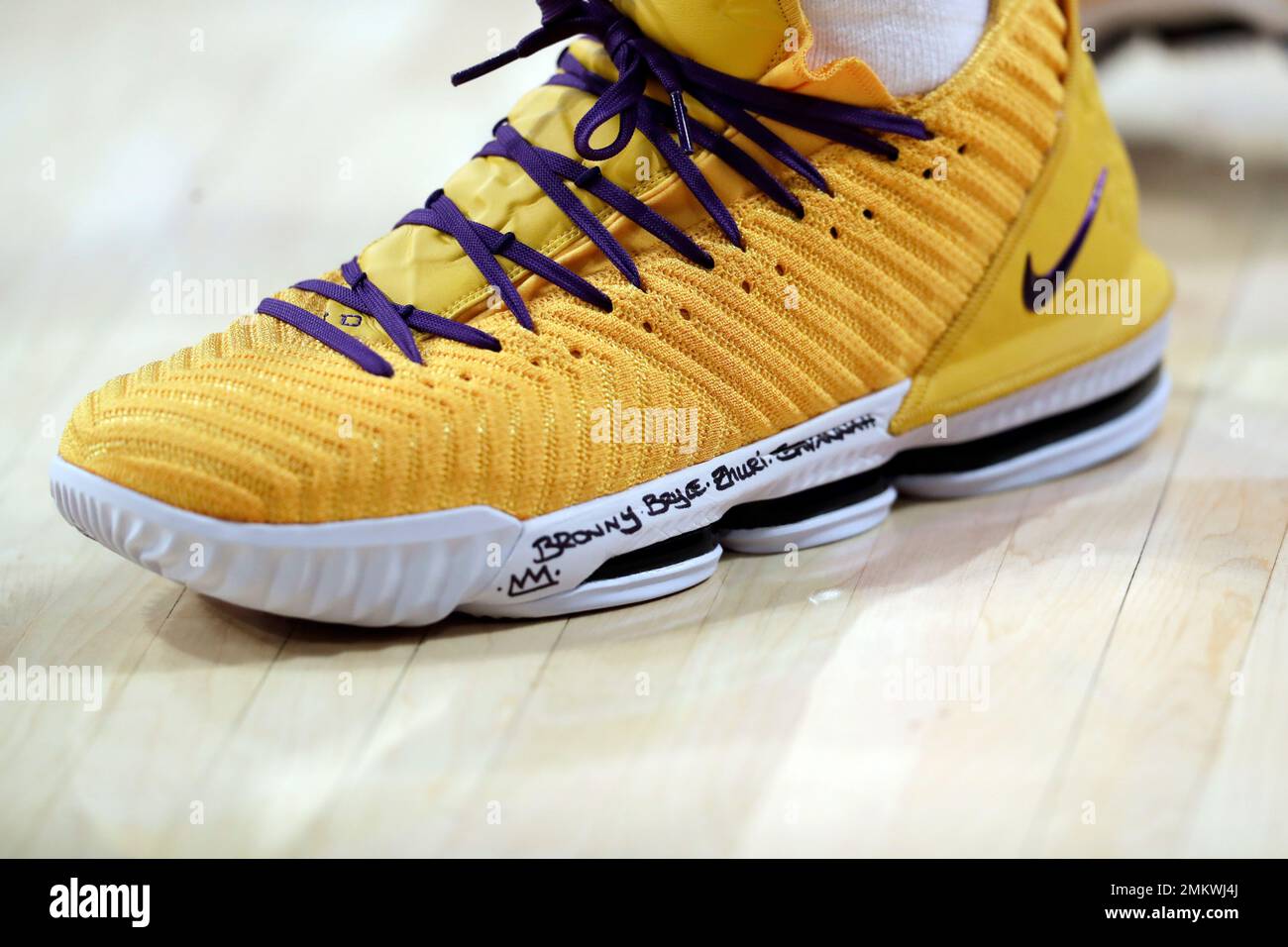 The names of Los Angeles Lakers' LeBron James' kids are written on his shoes  during an NBA basketball game against the Memphis Grizzlies Sunday, Dec. 23,  2018, in Los Angeles. (AP Photo/Marcio