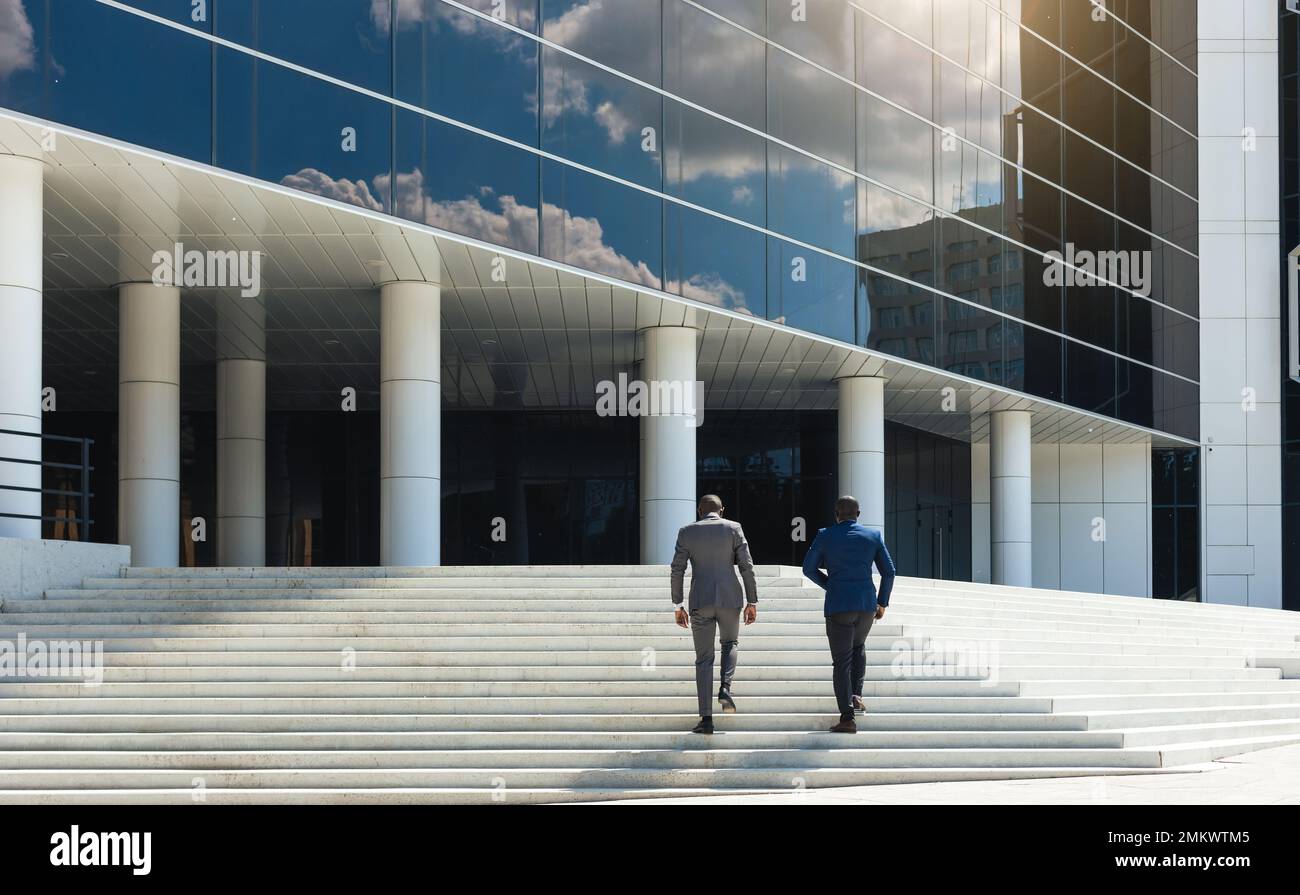 Business people climb the stairs of the city stairs. Closeup of the