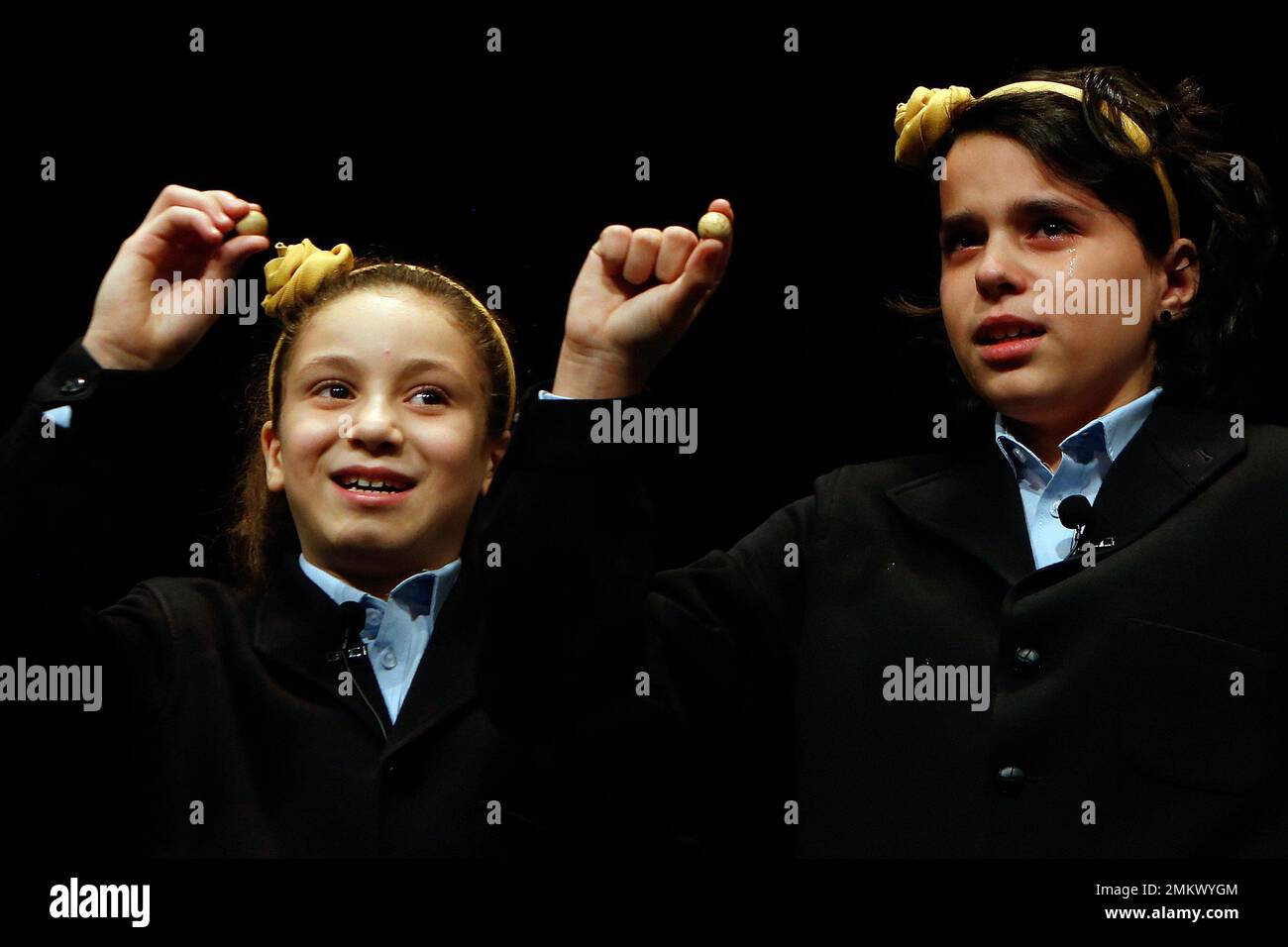 Children from Madrid s San Ildefonso school call out the winning