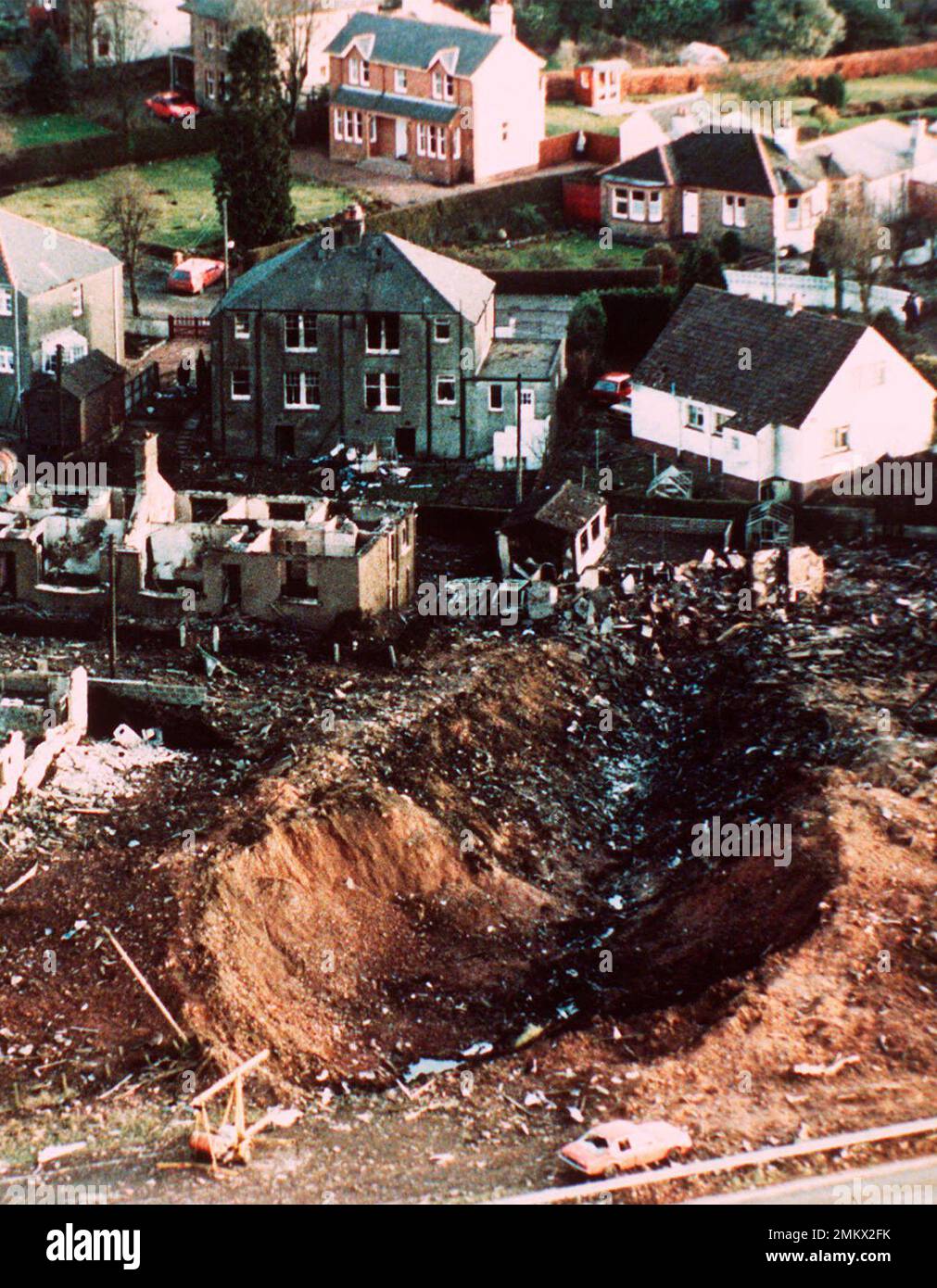 Lockerbie FILE - This Dec. 1988 file photo shows wrecked houses and a deep gash ...