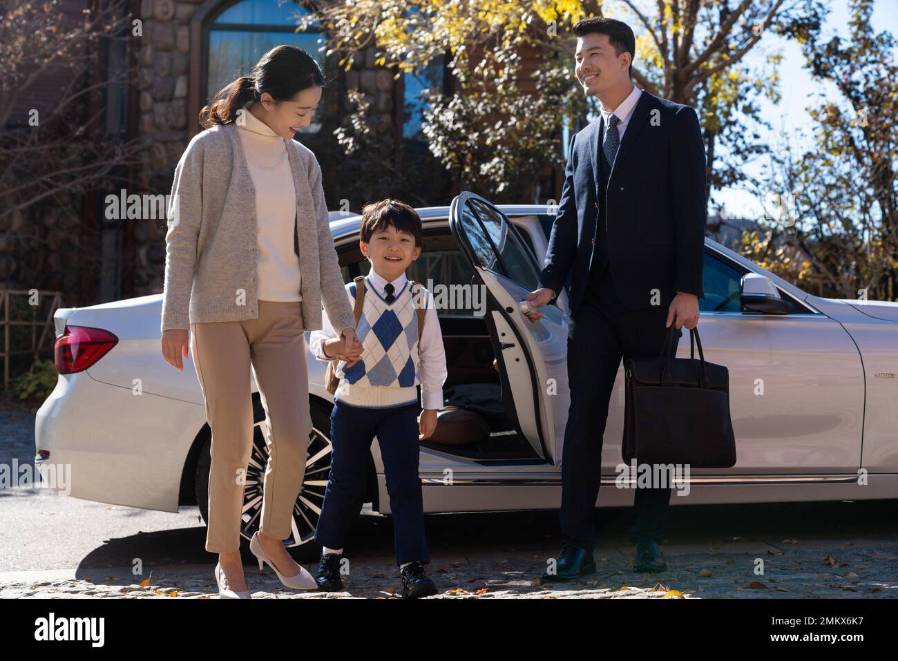 Chinese parents pick up their children from school hi-res stock ...