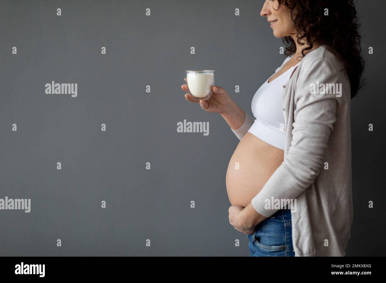 Dairy Foods During Pregnancy. Young Pregnant Woman Holding Glass Of