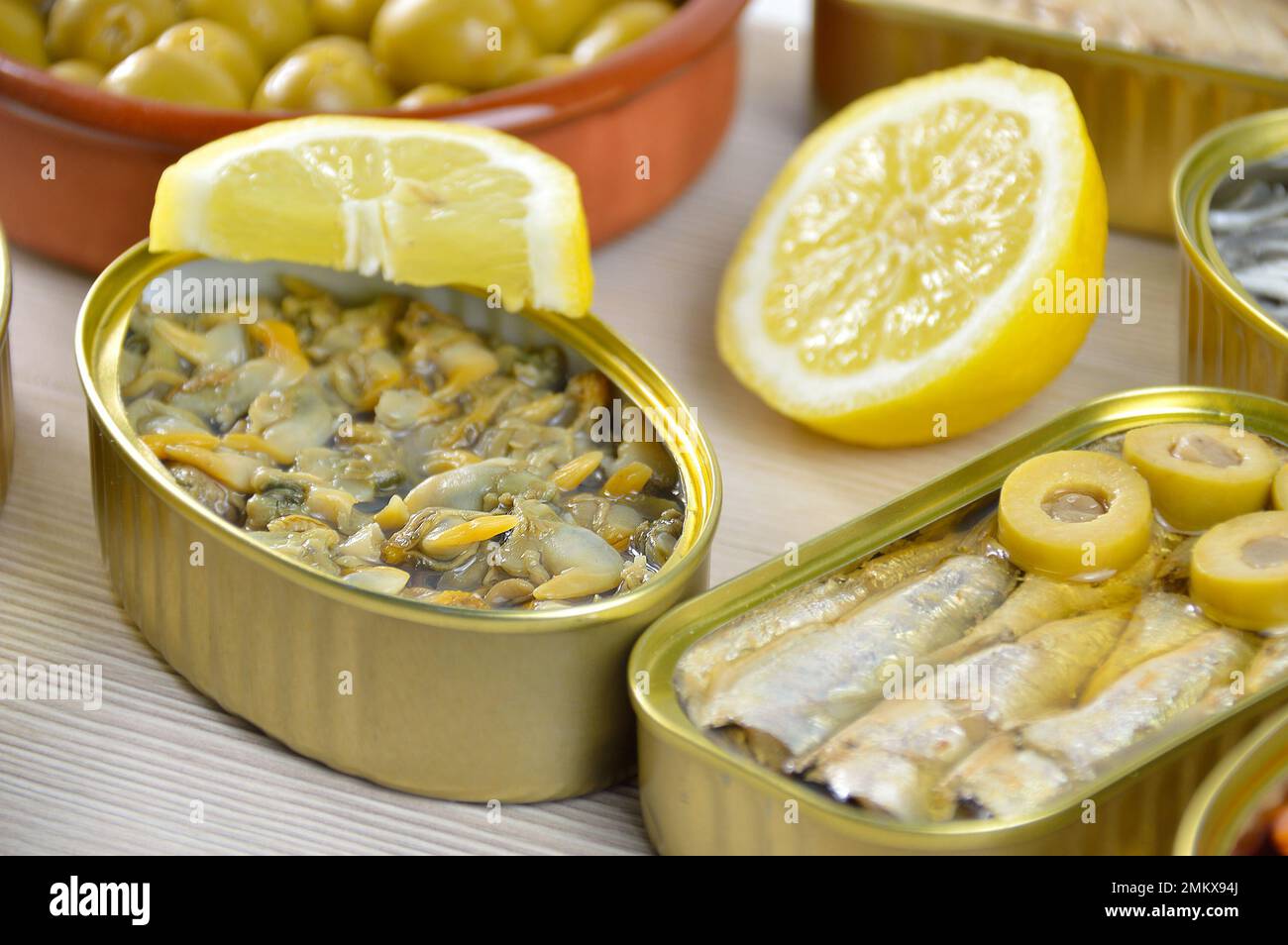 Assortment of cans of canned with different types of fish and seafood