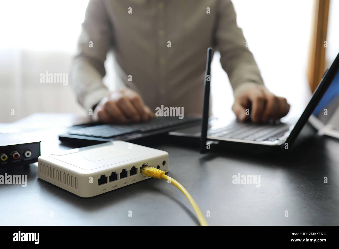 Man Using A Router Wifi router in home switch hi-res stock photography and images - Alamy