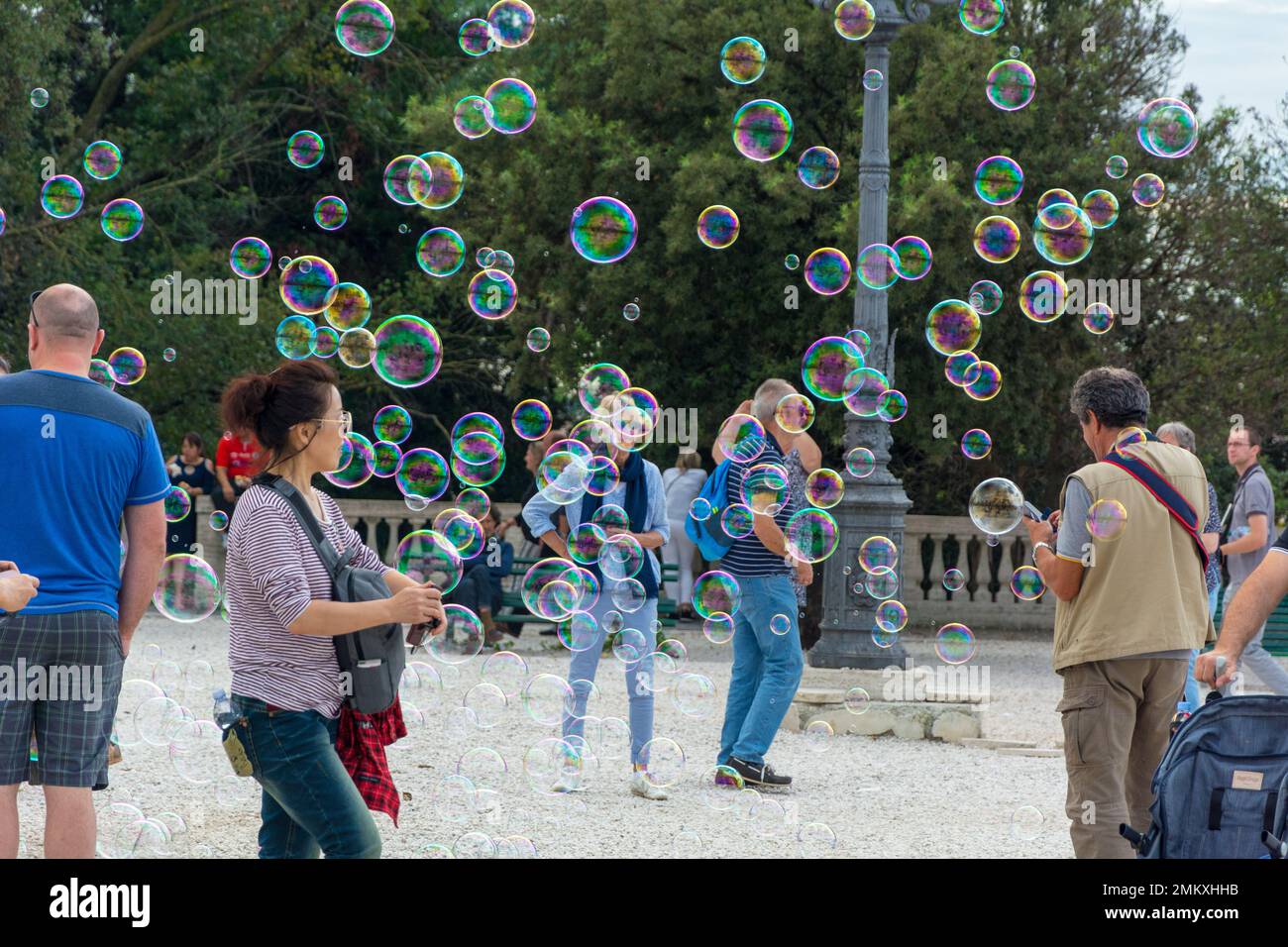 Rome, Italy - Oct 04, 2018: People rejoice in soap bubbles at Terrazza del Pincio in Rome Stock Photo