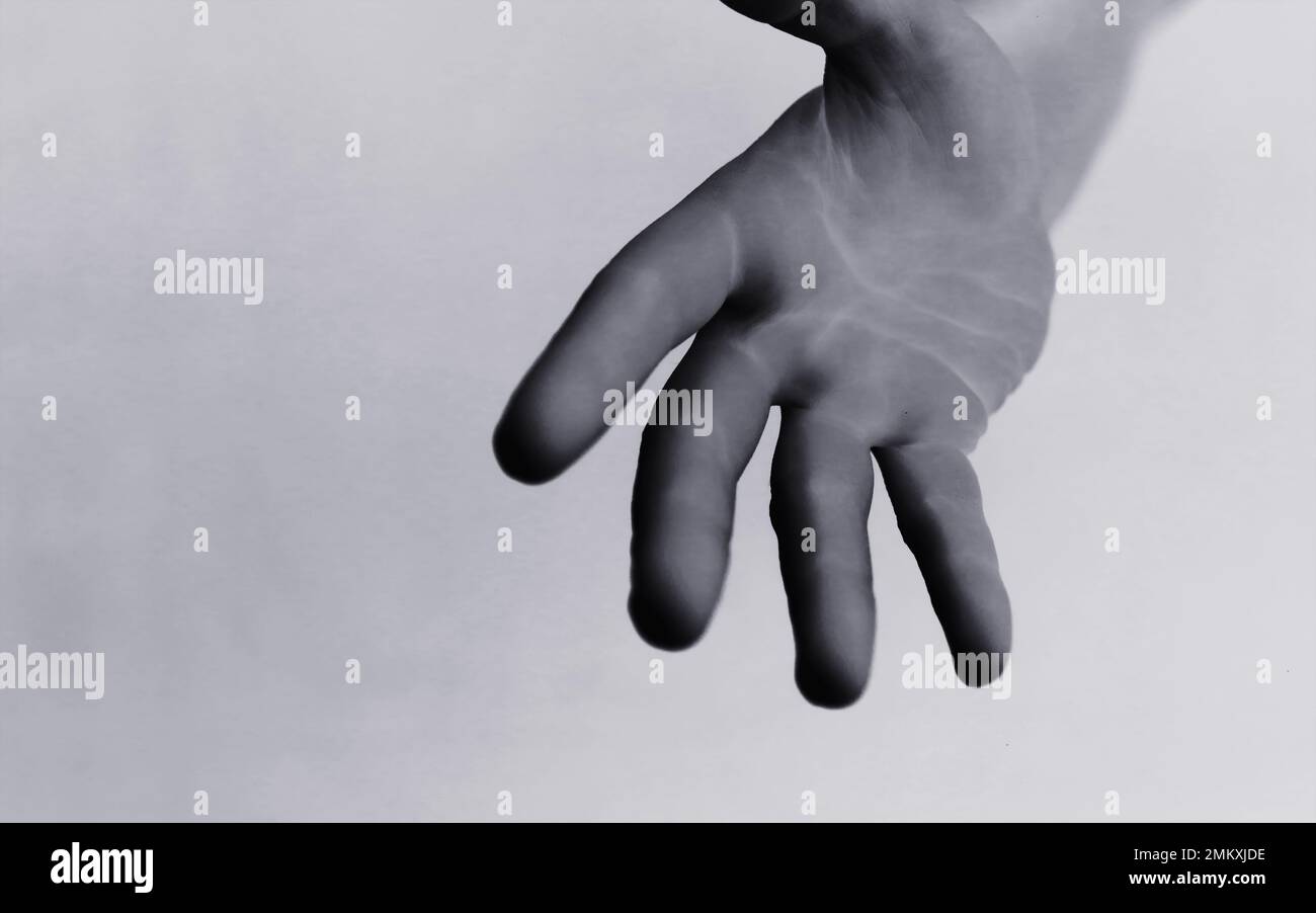 Male hands on a gray background. Finger gestures. Gesticulation hands. Stock Photo