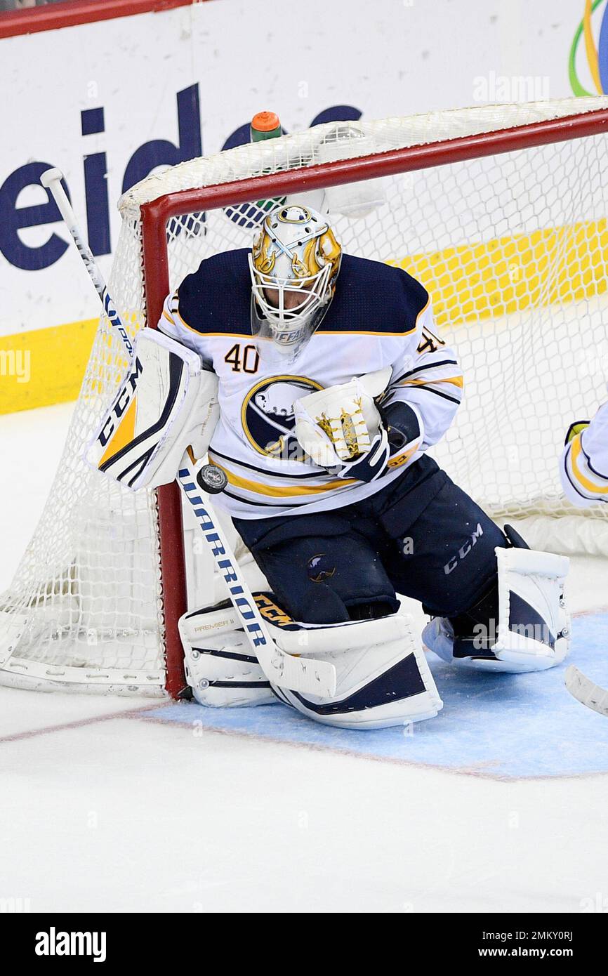 Buffalo Sabres goaltender Carter Hutton (40) stops the puck during the ...