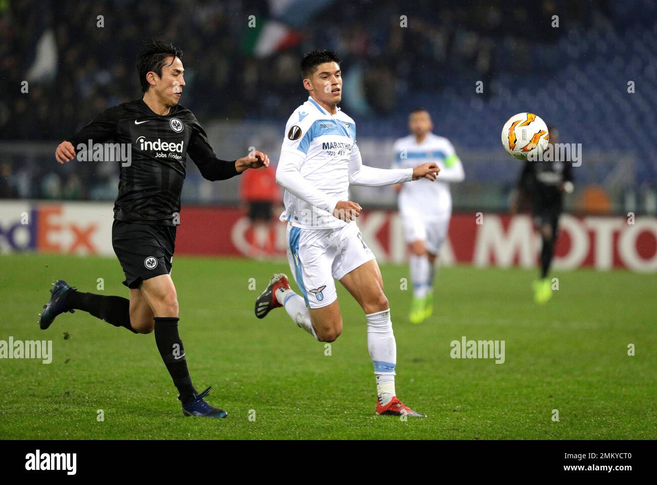 Frankfurt's Makoto Hasebe, left, and Lazio's Joaquin Correa run for the ...