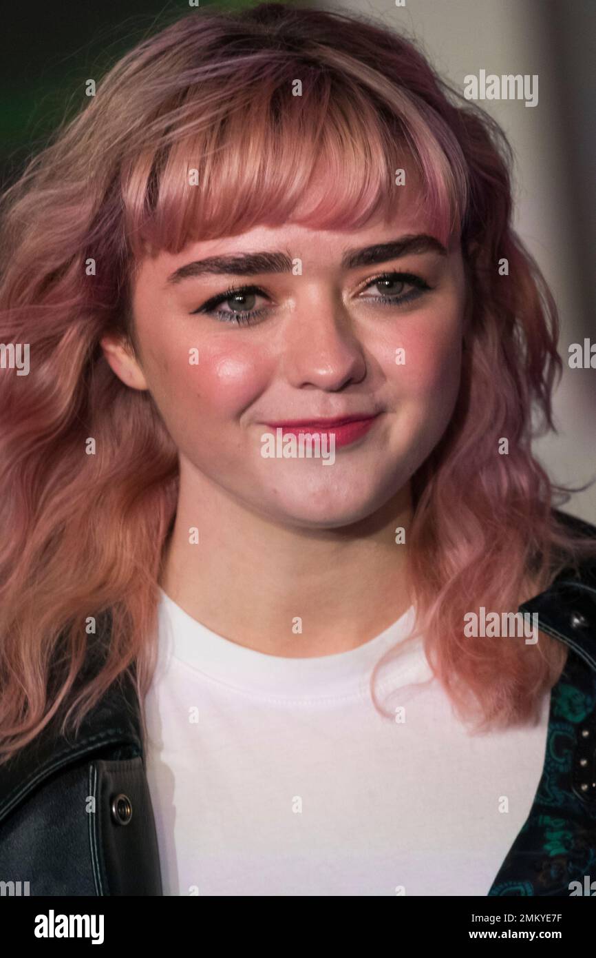 Actress Maisie Williams poses for photographers upon arrival at the