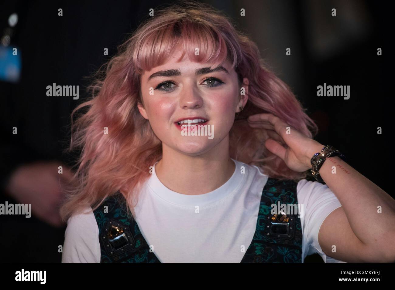 Actress Maisie Williams poses for photographers upon arrival at the