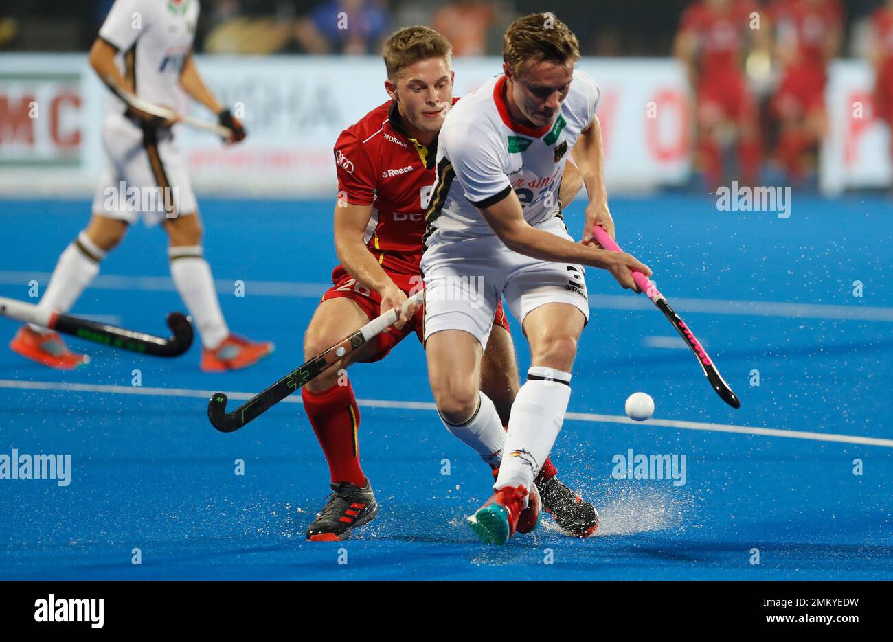 Germany's Mats Grambusch, right, competes for the ball with Belgium's  Victor Wegnez during the Men's Hockey World Cup quarterfinal match between  Belgium and Germany at the Kalinga Stadium in Bhubaneswar, India, Thursday,