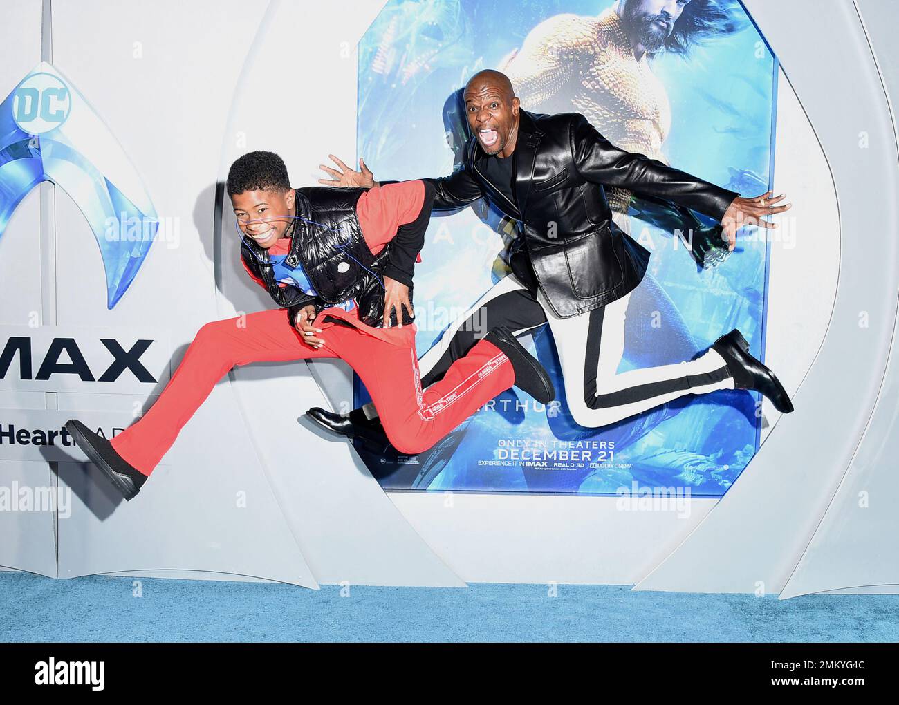 Isaiah Crews, left, and Terry Crews arrive at the premiere of "Aquaman