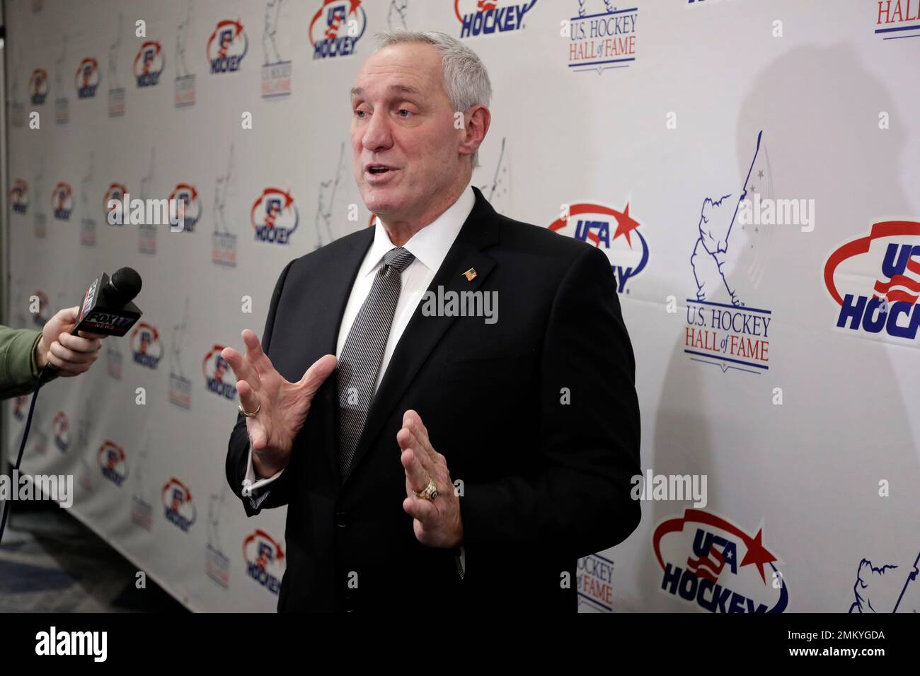 Retired NHL referee Paul Stewart answers questions before being