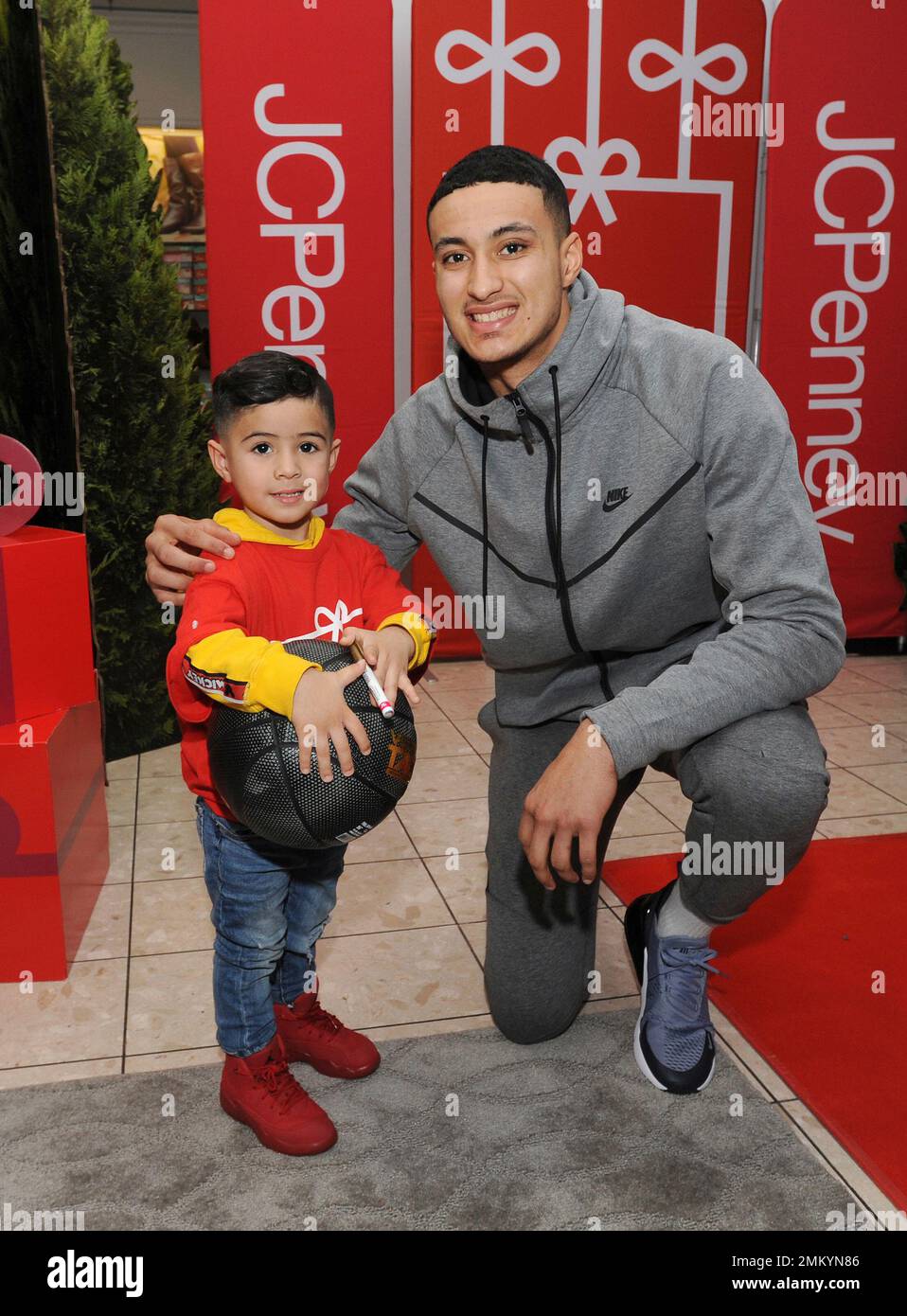 IMAGE DISTRIBUTED FOR JCPENNEY - Los Angeles Lakers Kyle Kuzma poses for a  photo with Luke Divelbiss, 3, of the Weingart East Los Angeles YMCA, at the  Glendale Galleria JCPenney store on Tuesday, Dec. 11, 2018, in Glendale,  Calif. Kuzma