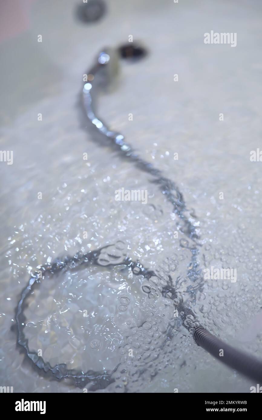 Soap bubbles background. Shampoo foam in the water in bathroom. Jacuzzi