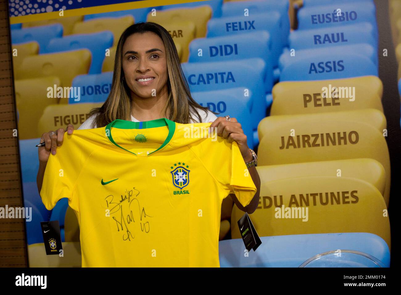 Brazil's Marta holds a Brazil's national jersey before making footprints of  her feet that will be placed on Brazil's Soccer Walk of Fame at the  Maracana stadium in Rio de Janeiro, Brazil