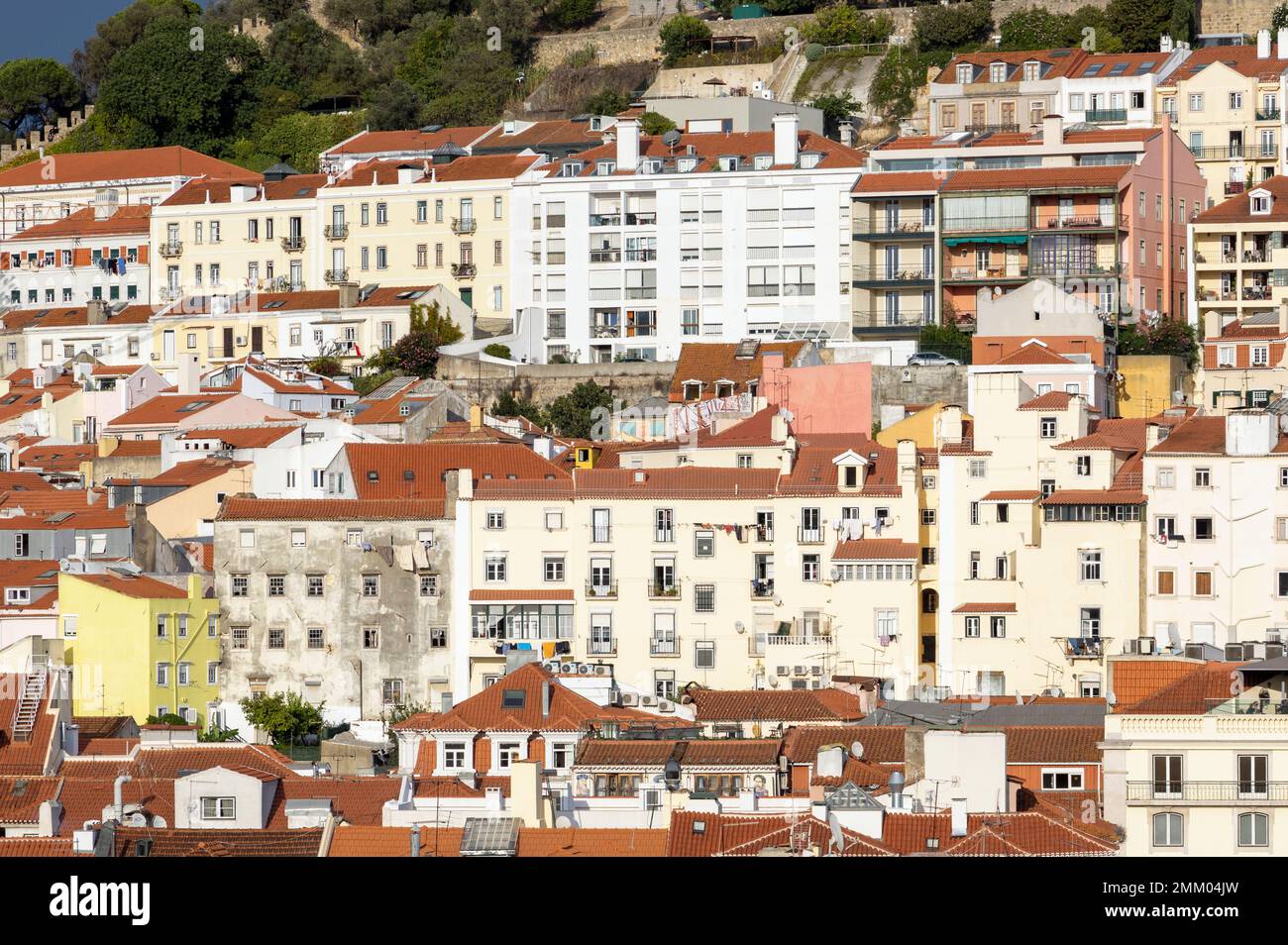 Lisbon, Portugal.  Cityscape.  Houses and apartments on the hill leading up to St George's castle. Stock Photo