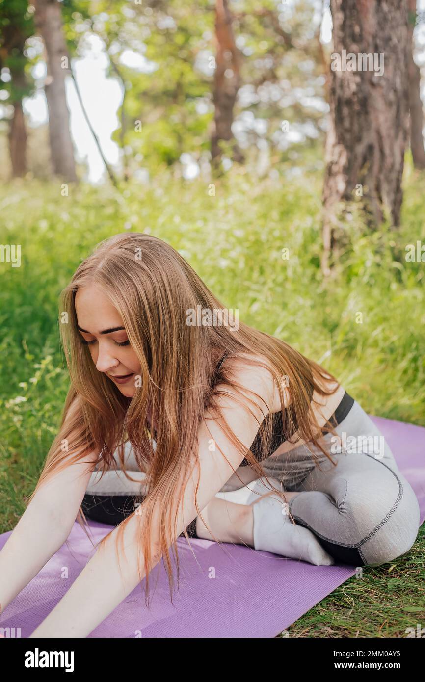 Woman exercise workout in gym fitness breaking relax holding apple fruit after training sport