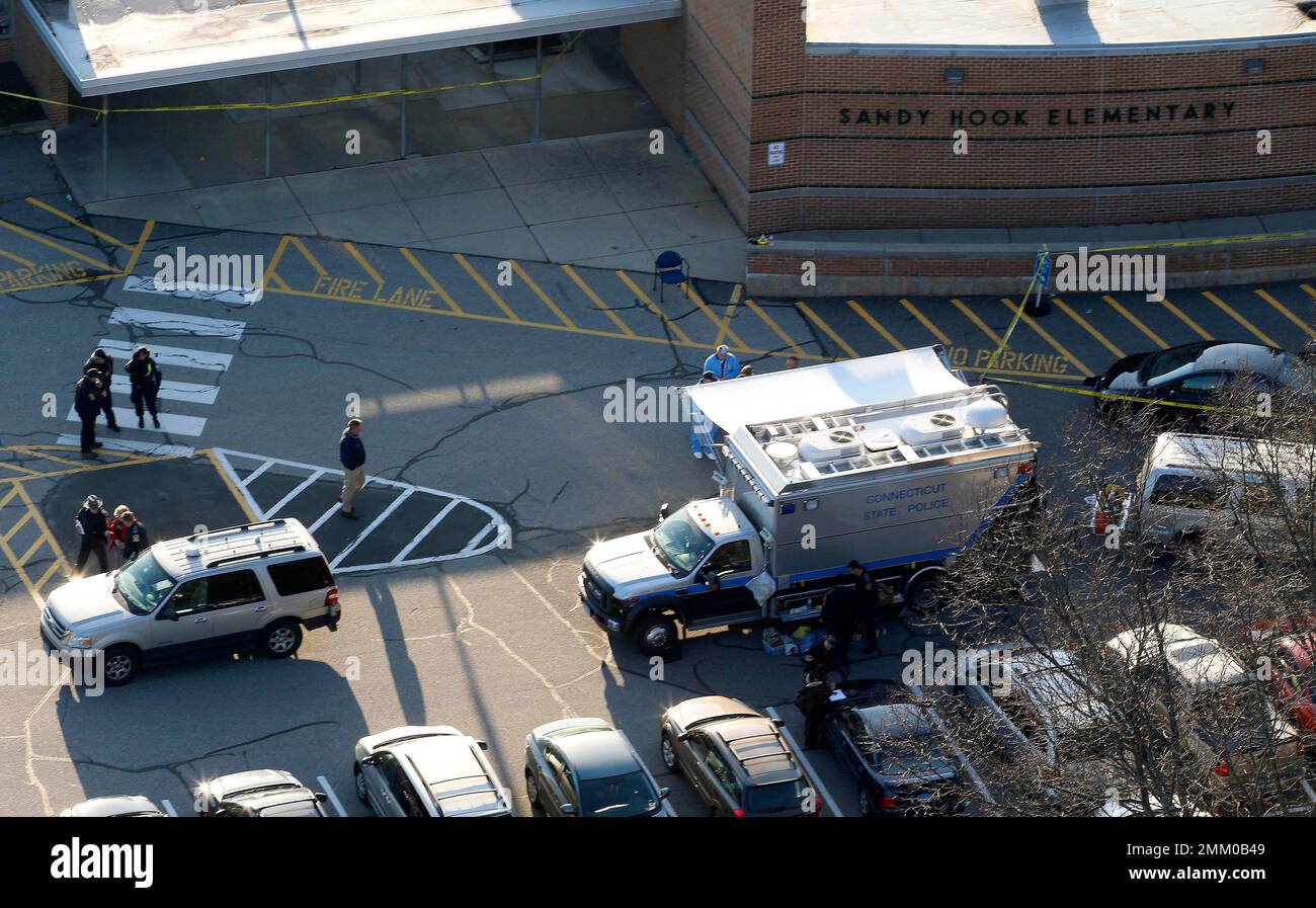 FILE In this Dec. 14, 2012, file photo, officials stand outside of