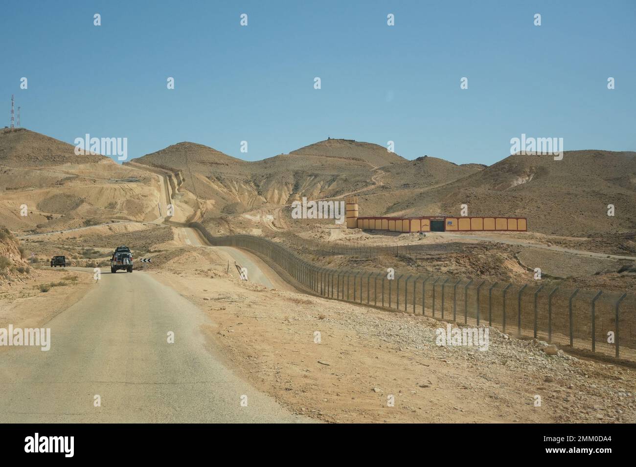 Route 10 along the Egyptian - Israeli border. Looking into Egypt from Israel. Egyptian Military Guard tower and border patrol base Stock Photo
