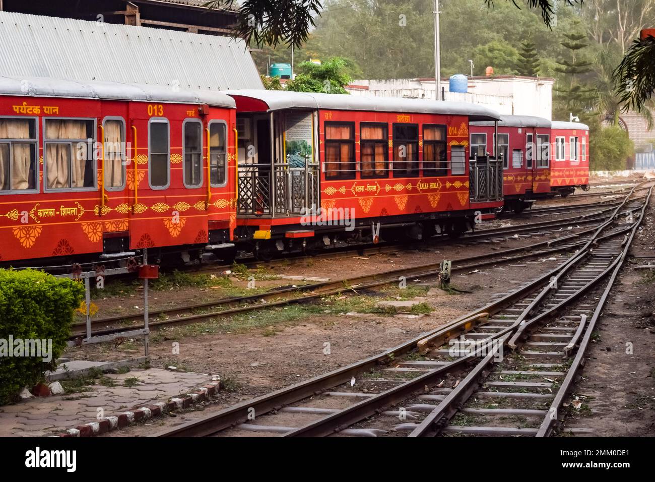 View of Toy train coach from the middle of railway track during daytime