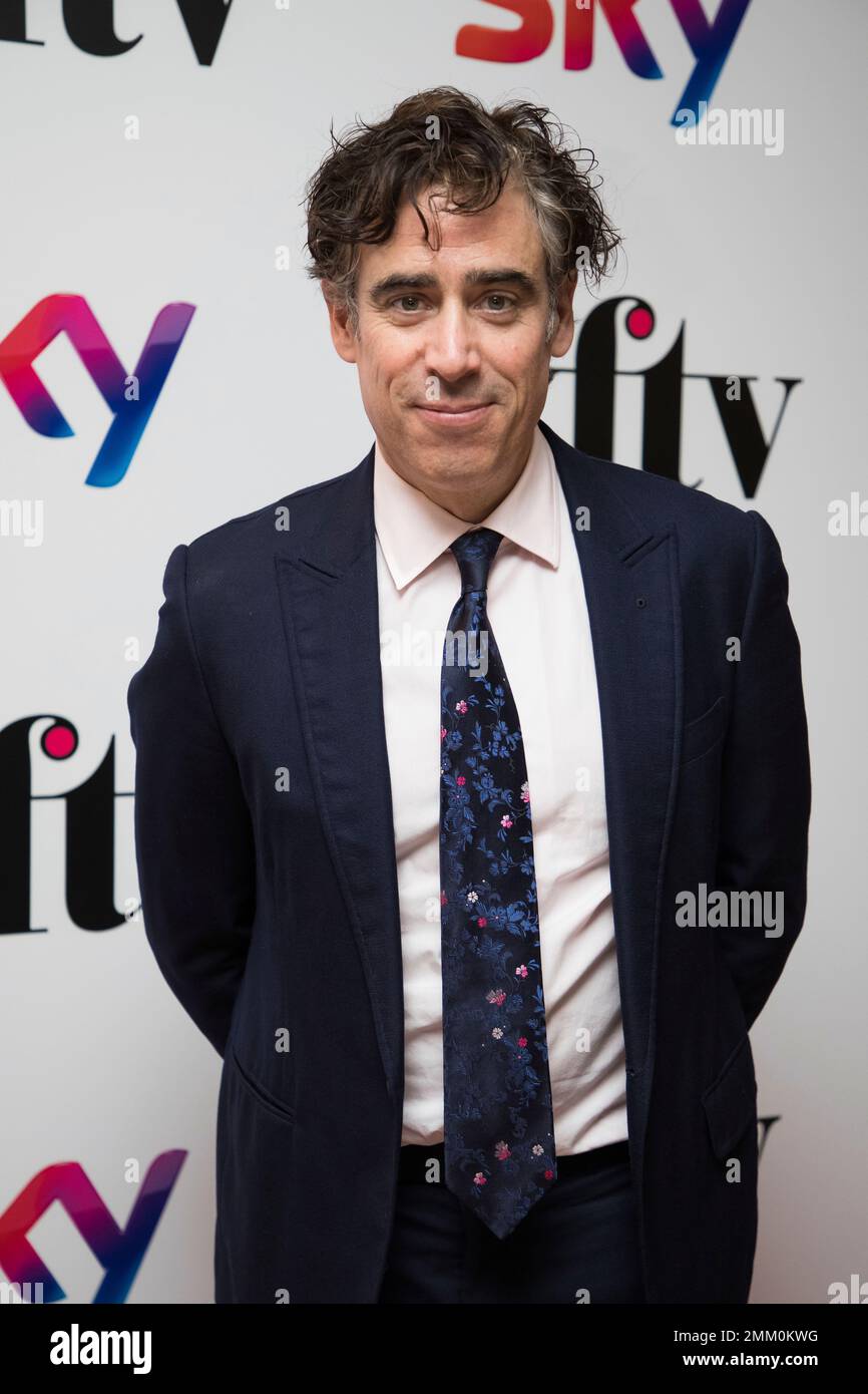 Actor Stephen Mangan poses for photographers upon arrival at the Women