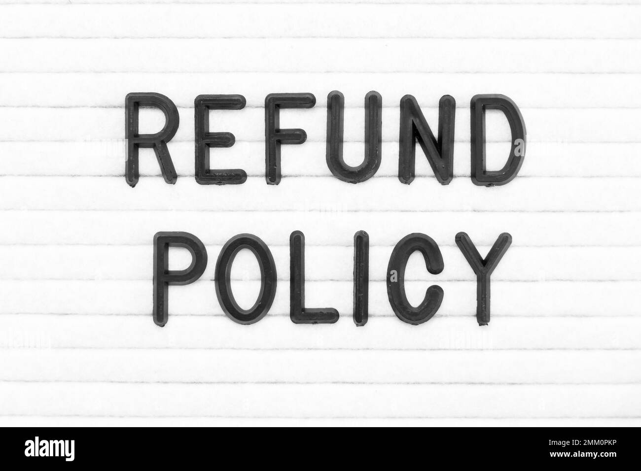 Black color letter in word refund policy on white felt board background