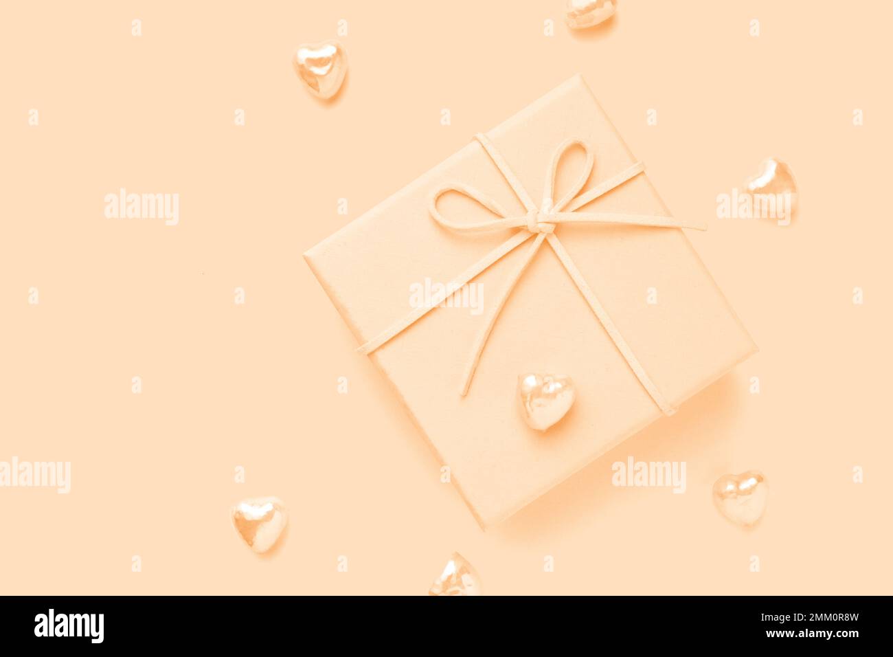 Top view photo of valentine's day decorations beige giftbox with hearts Stock Photo