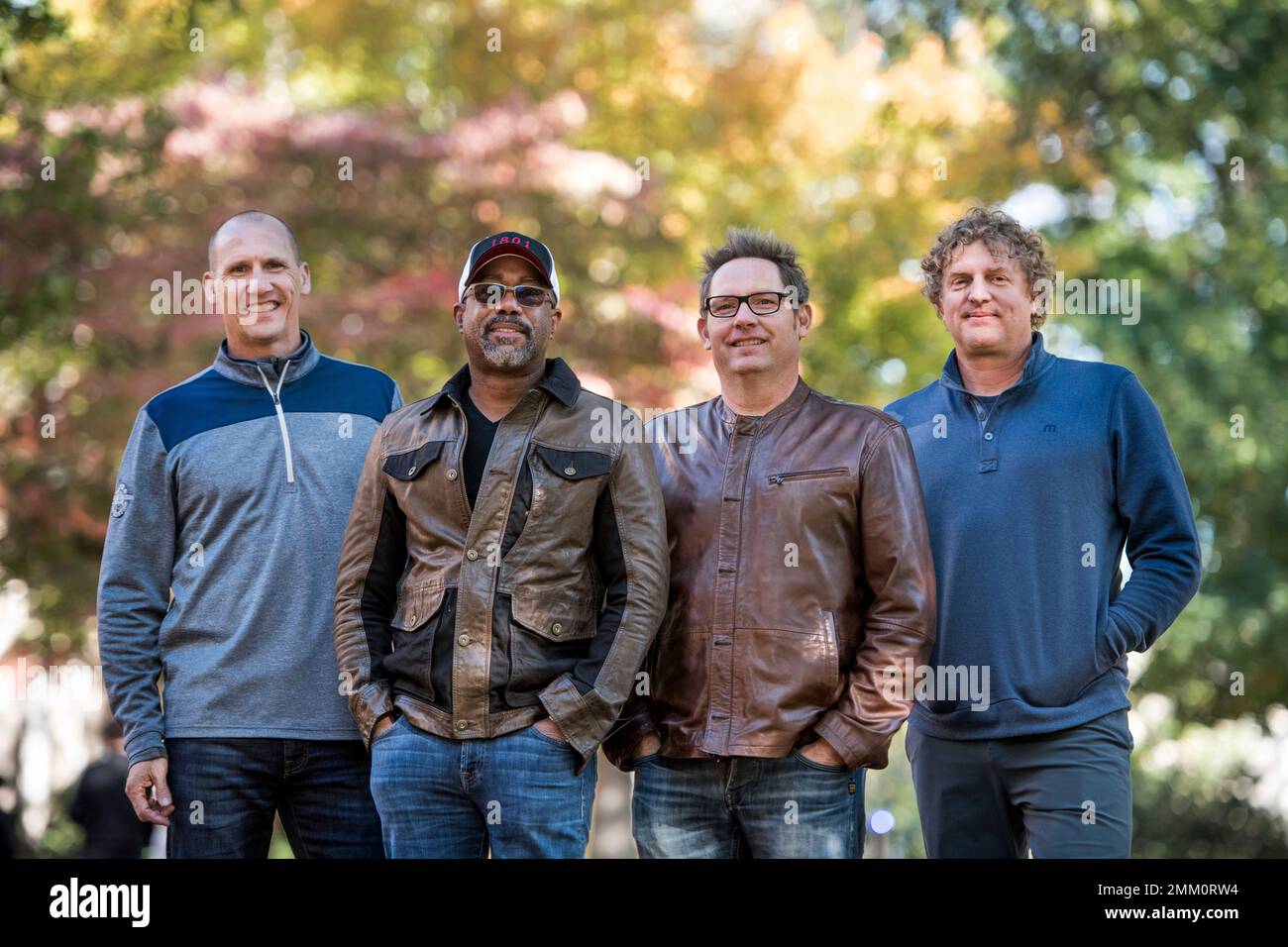 In this Nov. 16, 2018 photo, Jim Sonefeld, from left, Darius Rucker, Dean Felber, and Mark Bryan, of Hootie & the Blowfish, pose for a portrait at the University of South Carolina in Columbia, S.C. The band is returning with a tour and album 25 years after "Cracked Rear View" launched the South Carolina-based rock band. (Photo by Sean Rayford/Invision/AP) Stock Photo