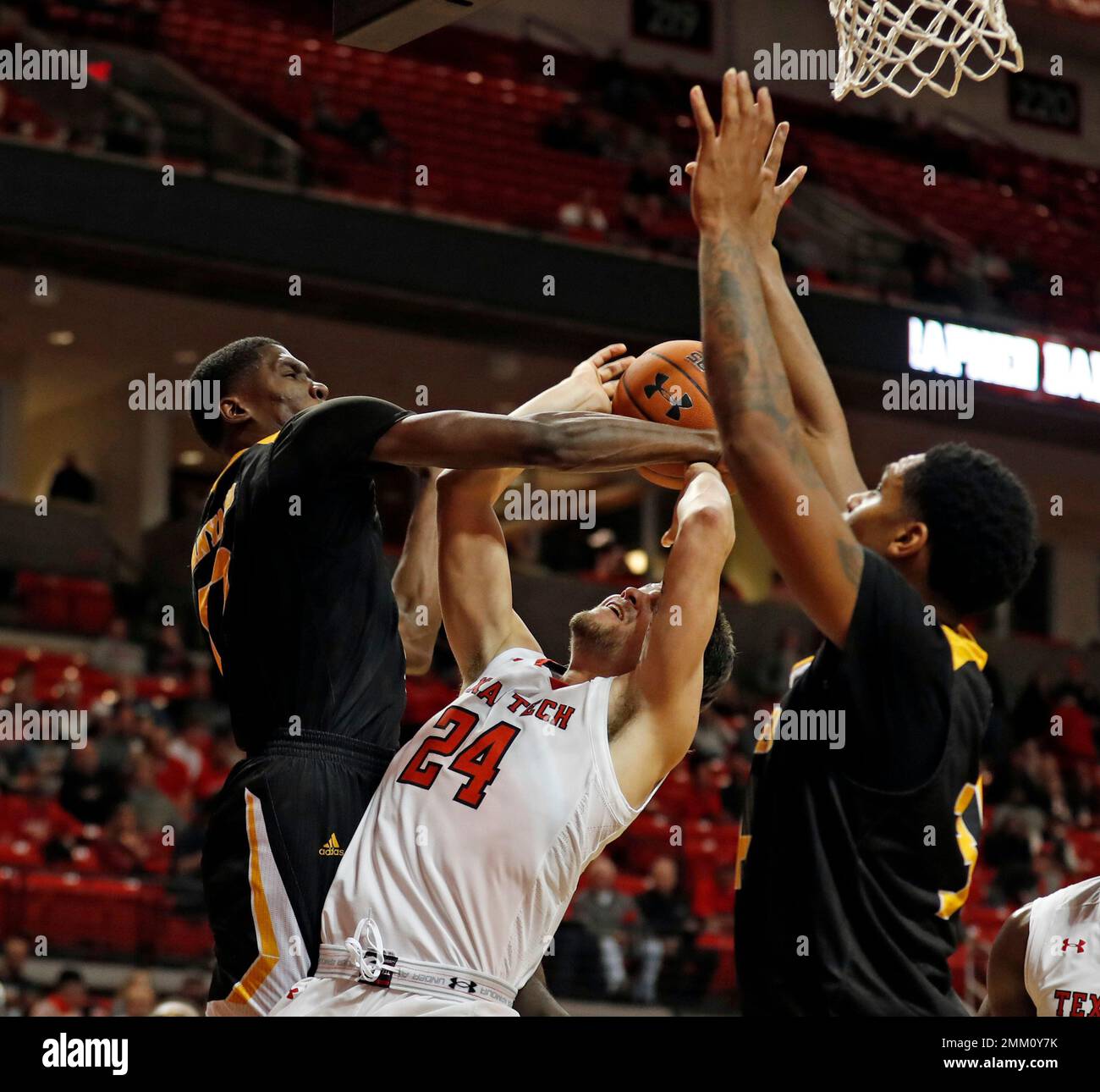ArkansasPine Bluff's Terrance Banyard (12) fouls Texas Tech's Avery