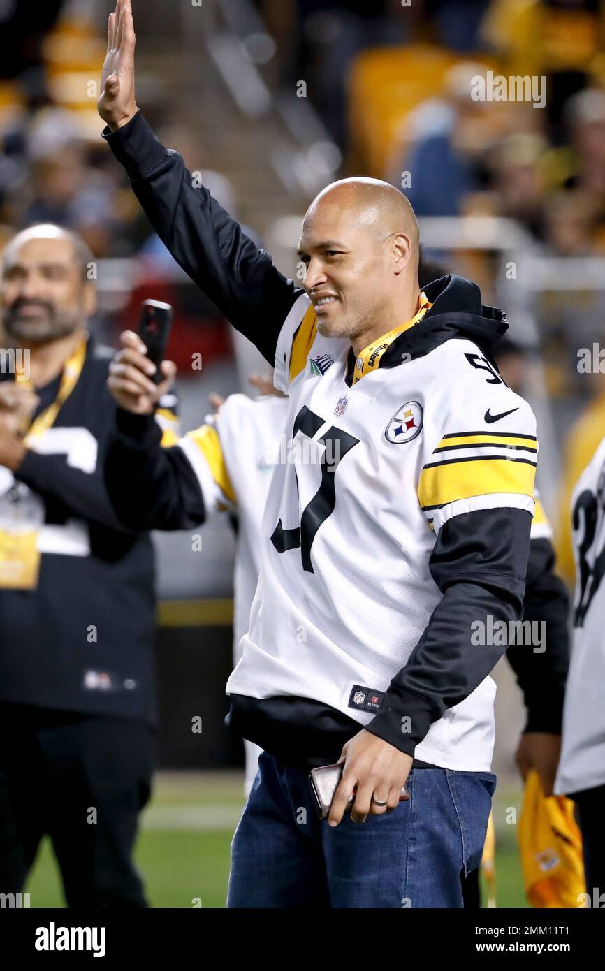 Former Pittsburgh Steelers linebacker James Harrison, right, talks with  defensive lineman Aaron Smith during a halftime ceremony honoring former  Steelers players during halftime of the NFL football game between the  Pittsburgh Steelers