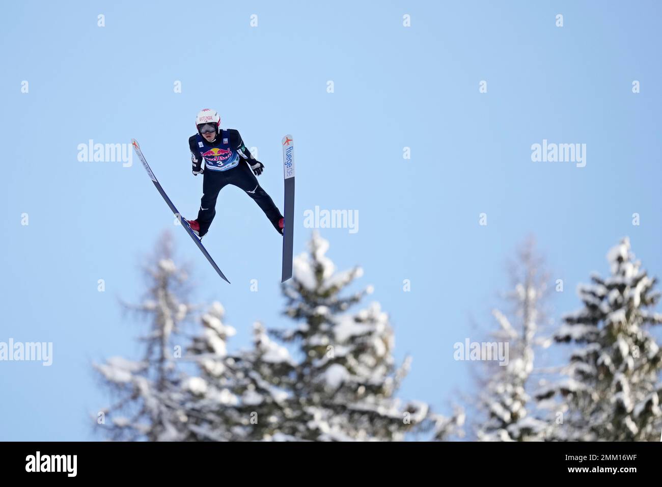 Naomi Nakamura, of Japan, soars through the air during his first round