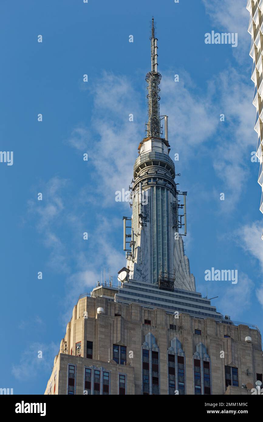 NYC: Empire State Building’s signature mast, originally conceived as a dirigible mooring mast, is now an observation deck and broadcast tower. Stock Photo