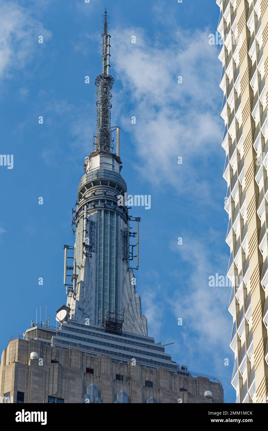 NYC: Empire State Building’s signature mast, originally conceived as a dirigible mooring mast, is now an observation deck and broadcast tower. Stock Photo