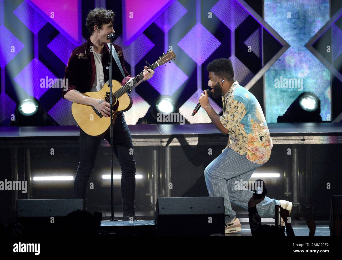 Shawn Mendes, left, and Khalid perform at Jingle Ball on Friday, Nov