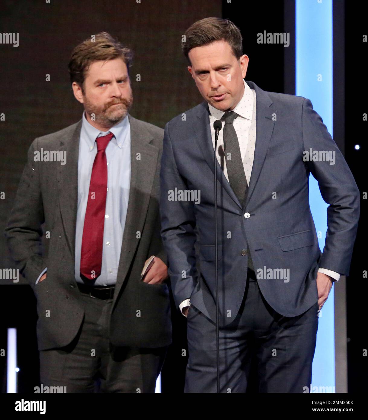 Zach Galifianakis, left, and Ed Helms speak at the American