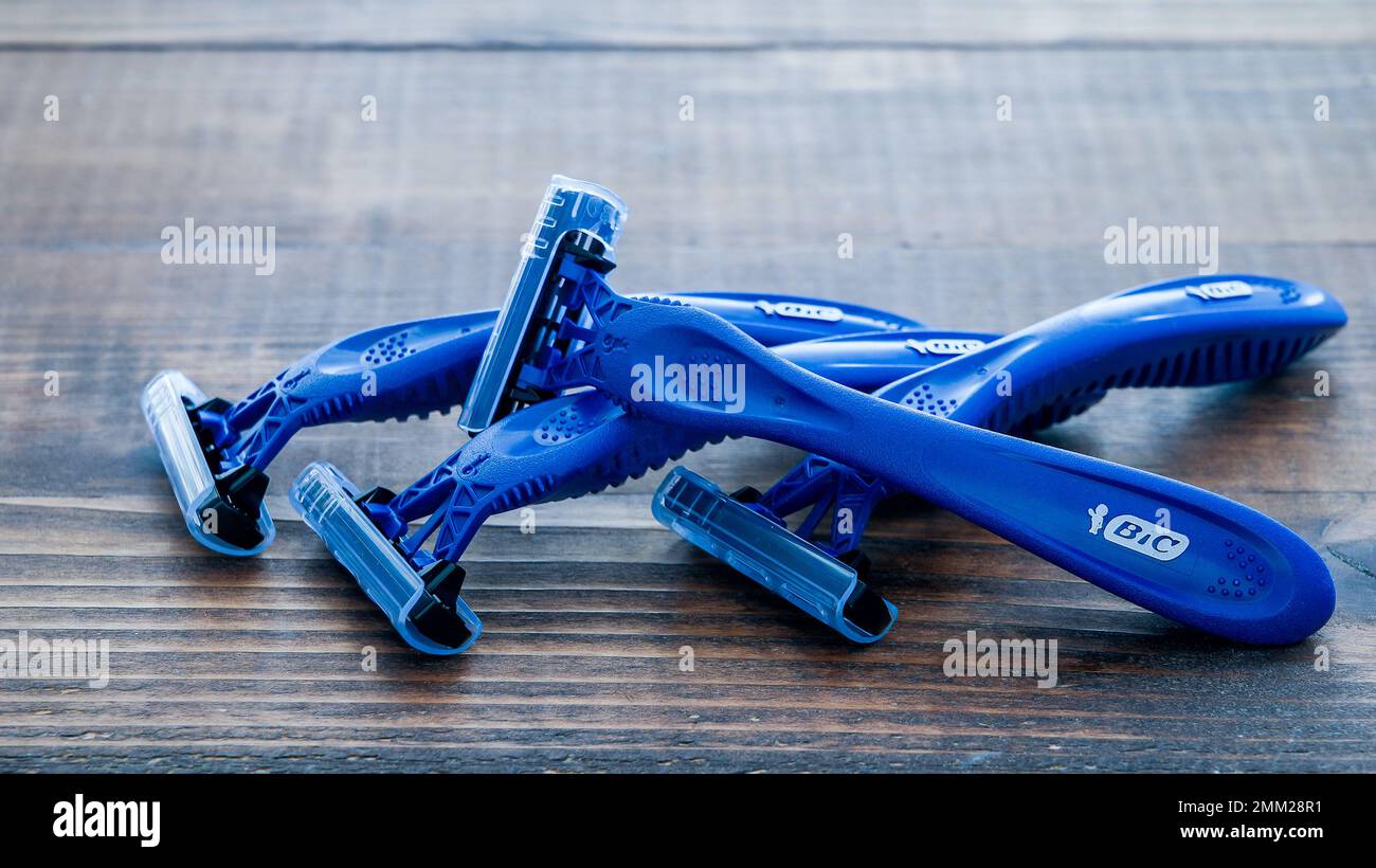 NORWALK, CT, USA - JANUARY, 27, 2023: Shaving blades from Bic Comfort 3 with three blades on wooden background Stock Photo