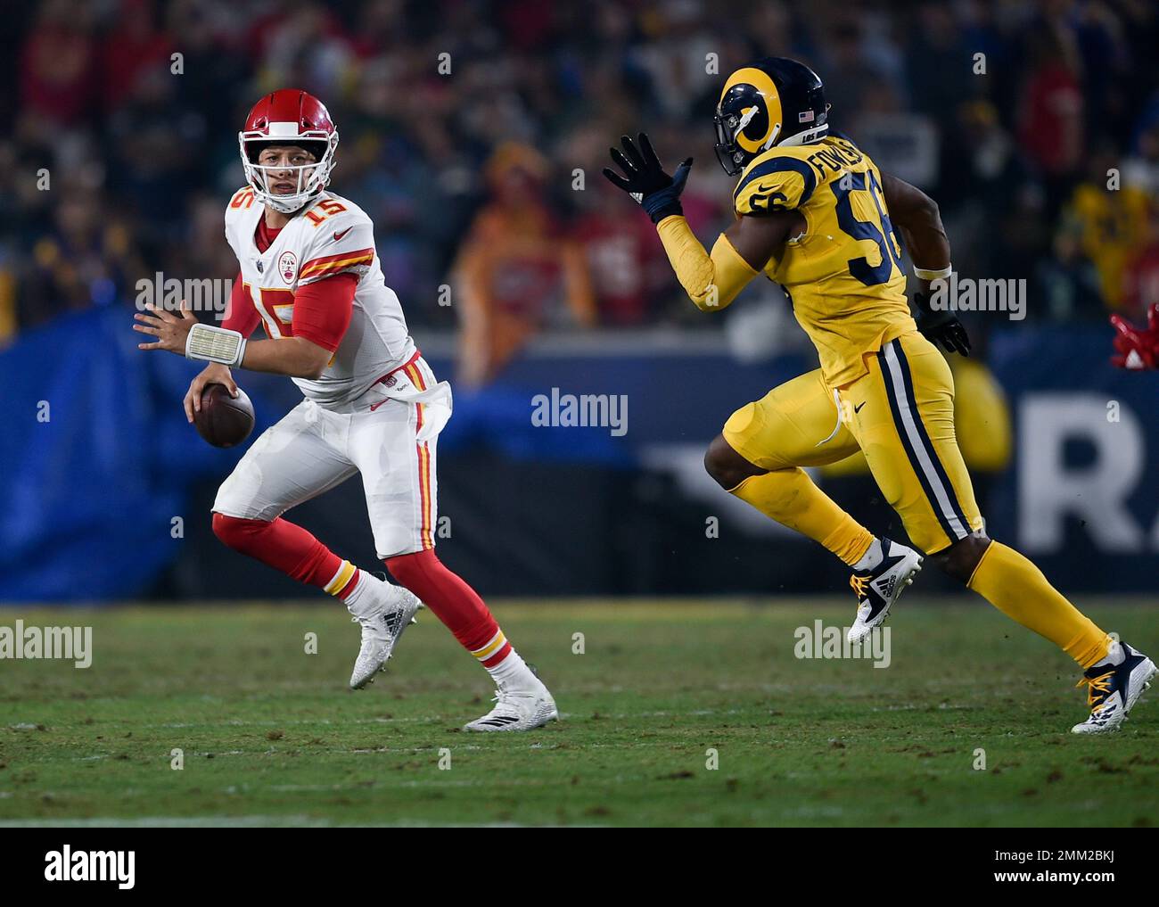 Kansas City Chiefs quarterback Patrick Mahomes, left, looks to pass