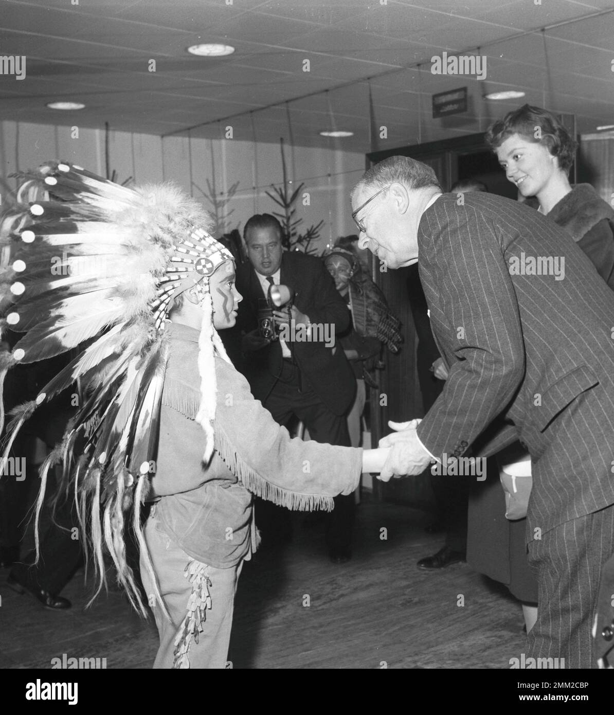 Carl XVI Gustaf, King of Sweden. Born 30 april 1946. Pictured wearing an native american costume at his school Broms 1958 together with his grandfather king Gustaf VI Adolf. ref BV3-12 Stock Photo