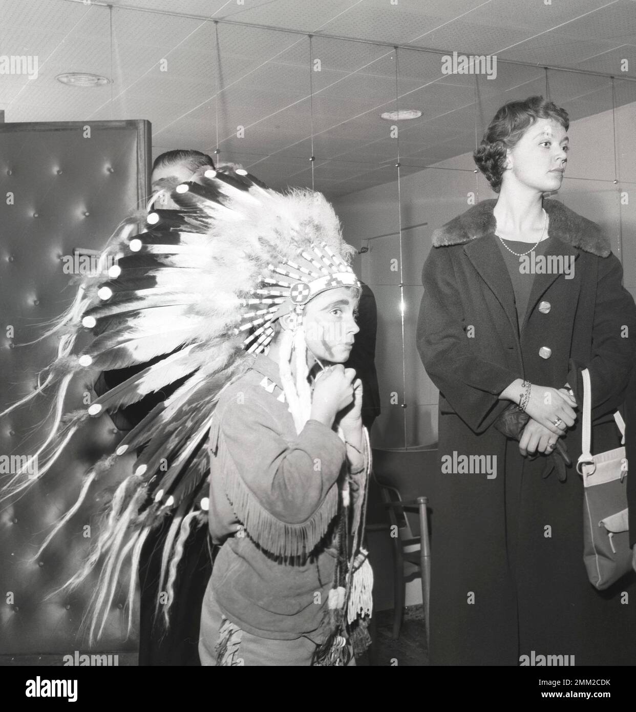 Carl XVI Gustaf, King of Sweden. Born 30 april 1946. Pictured wearing an native american costume at his school Broms 1958 together with his sister princess Birgitta. BV3-10 Stock Photo