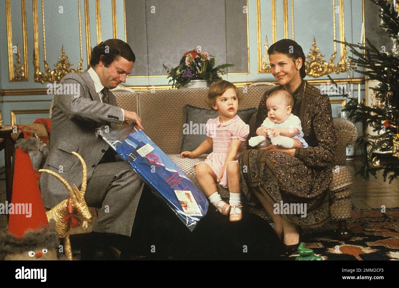 Carl XVI Gustaf, King of Sweden. Born 30 april 1946. Pictured with Queen Silvia and their daughters crown princess Victoria and princess Madeleine at christmas december 1979. Stock Photo