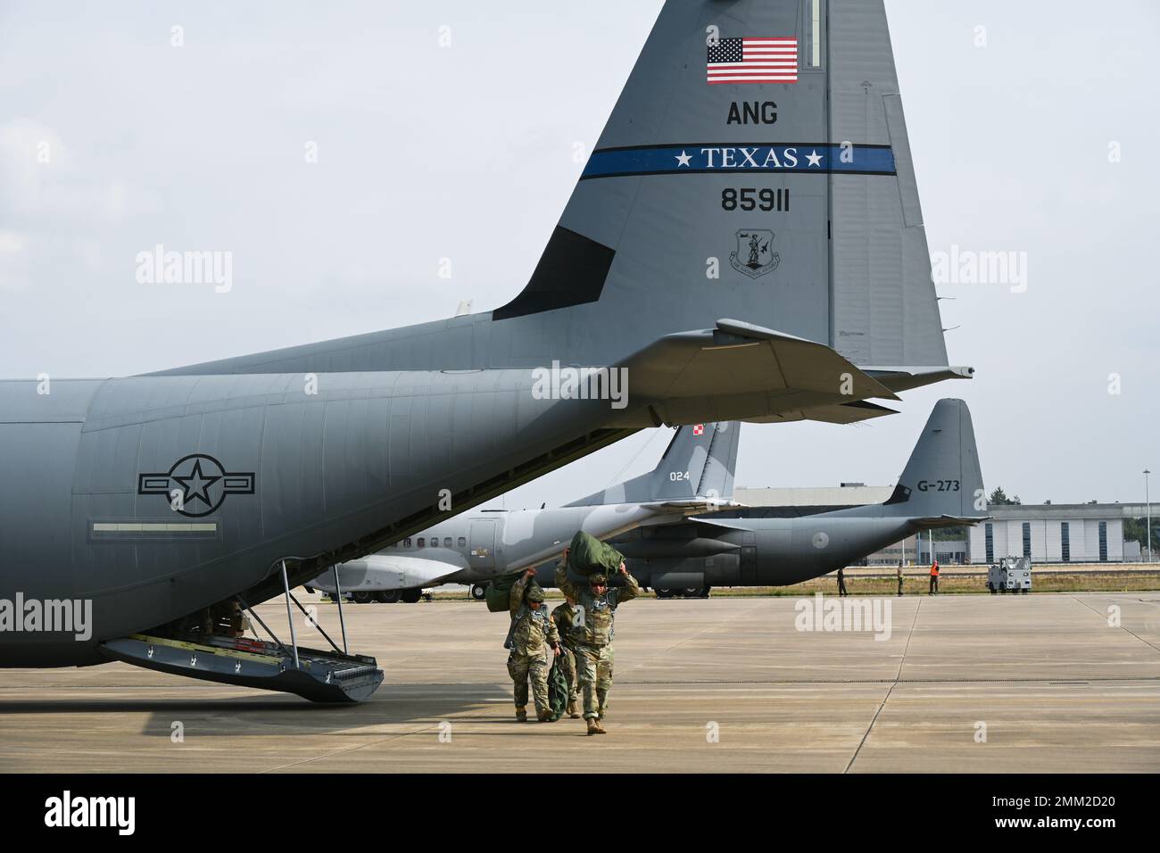 Army Airborne rigger team exit 136th Airlift Wings' C-130 J Model ...