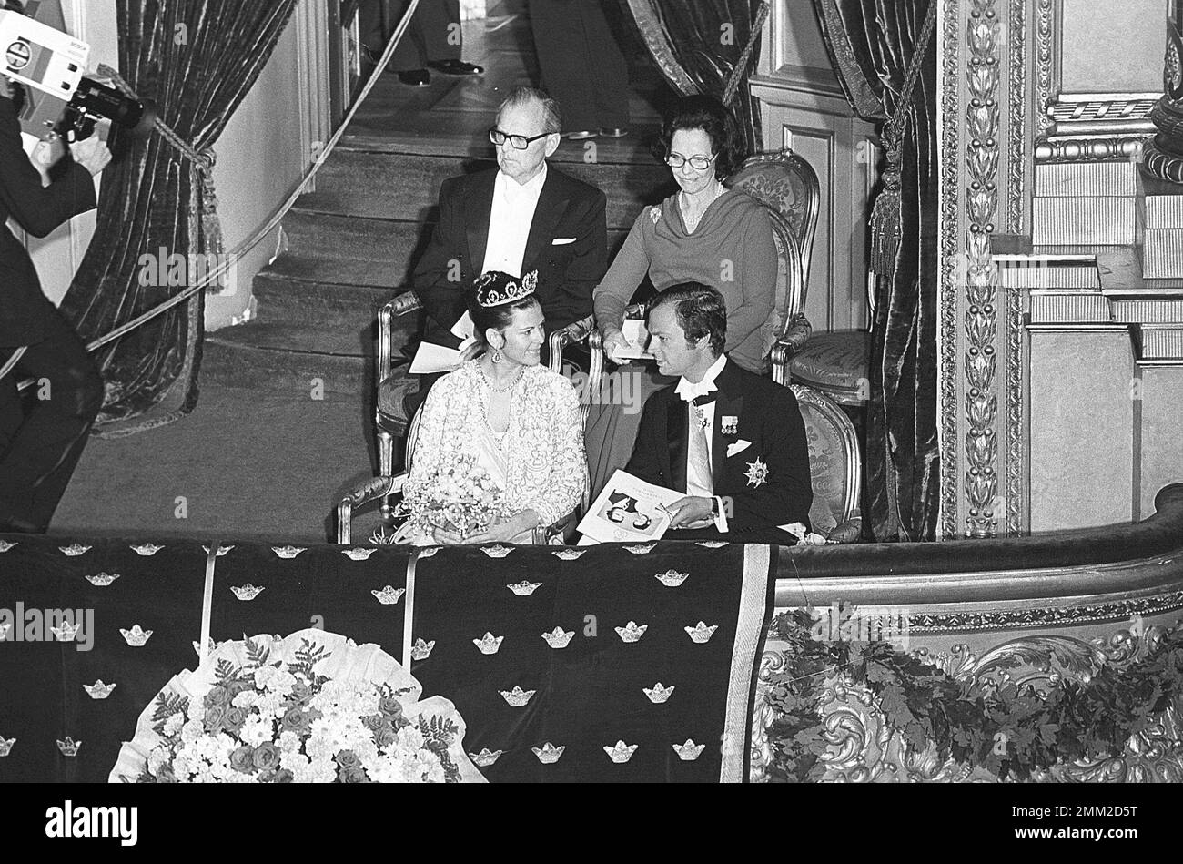 Wedding of Carl XVI Gustaf and Silvia Sommerlath. Carl XVI Gustaf, King of Sweden. Born 30 april 1946. Pictured in the evening the day before their wedding at a gala at the royal opera in Stockholm 18 june 1976. Silivas mother and father is sitting behind them, Walther and Alice Sommerlath.  ref BV36-7 Stock Photo