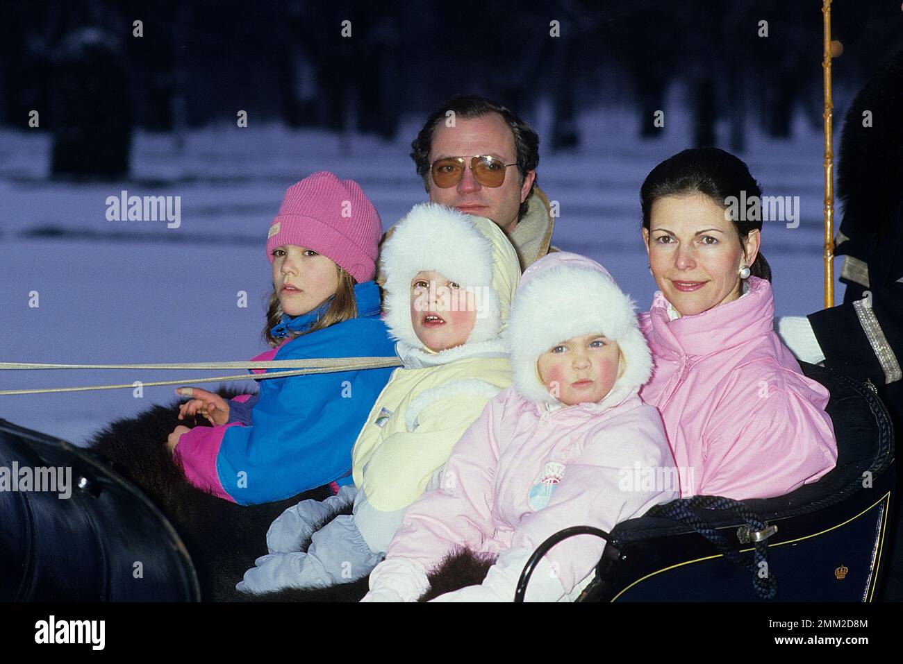 Carl XVI Gustaf, King of Sweden. Born 30 april 1946.  The King Carl XVI Gustaf,  Queen Silvia and their children, princess Madeleine, crown princess Victoria, prince Carl Philip, pictured in the park of Drottningholm castle 1985 at the annual christmas/winter photo session. Stock Photo