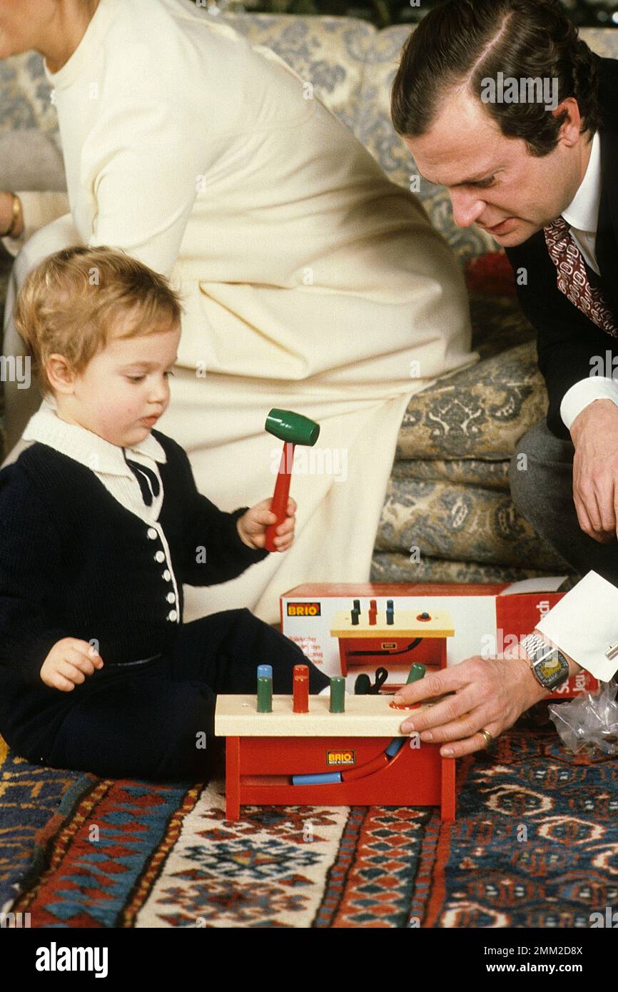 Carl XVI Gustaf, King of Sweden. Born 30 april 1946. Pictured with his son prince Carl Philip in a christmas photosession december 1981. Stock Photo