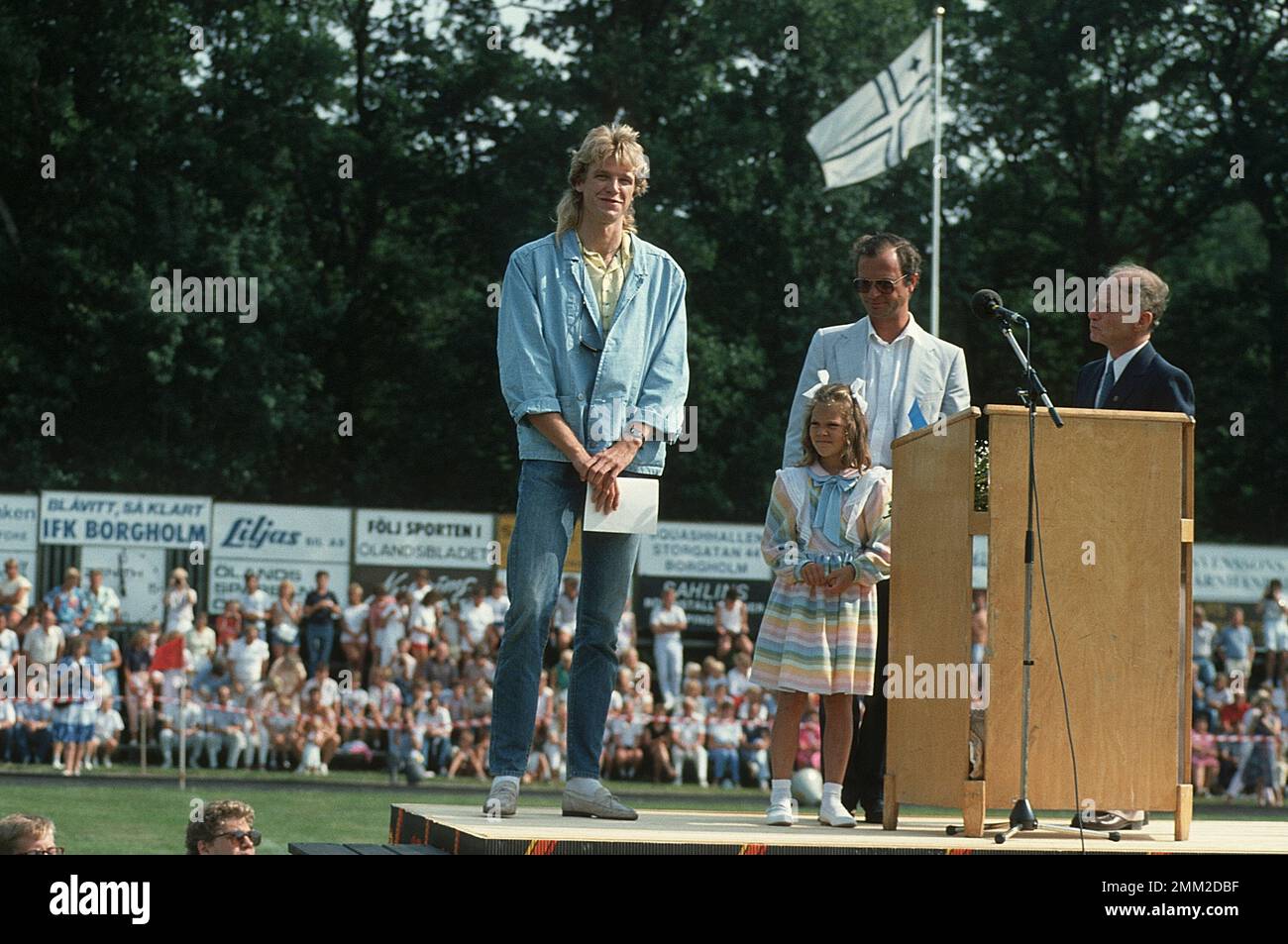 Carl XVI Gustaf, King of Sweden. Born 30 april 1946.  The King Carl XVI Gustaf and his daughter crown princess Victoria on Victoriaday 14 july 1985. Patrik Sjöberg who recieved the Victoria Award this year to the left. Stock Photo